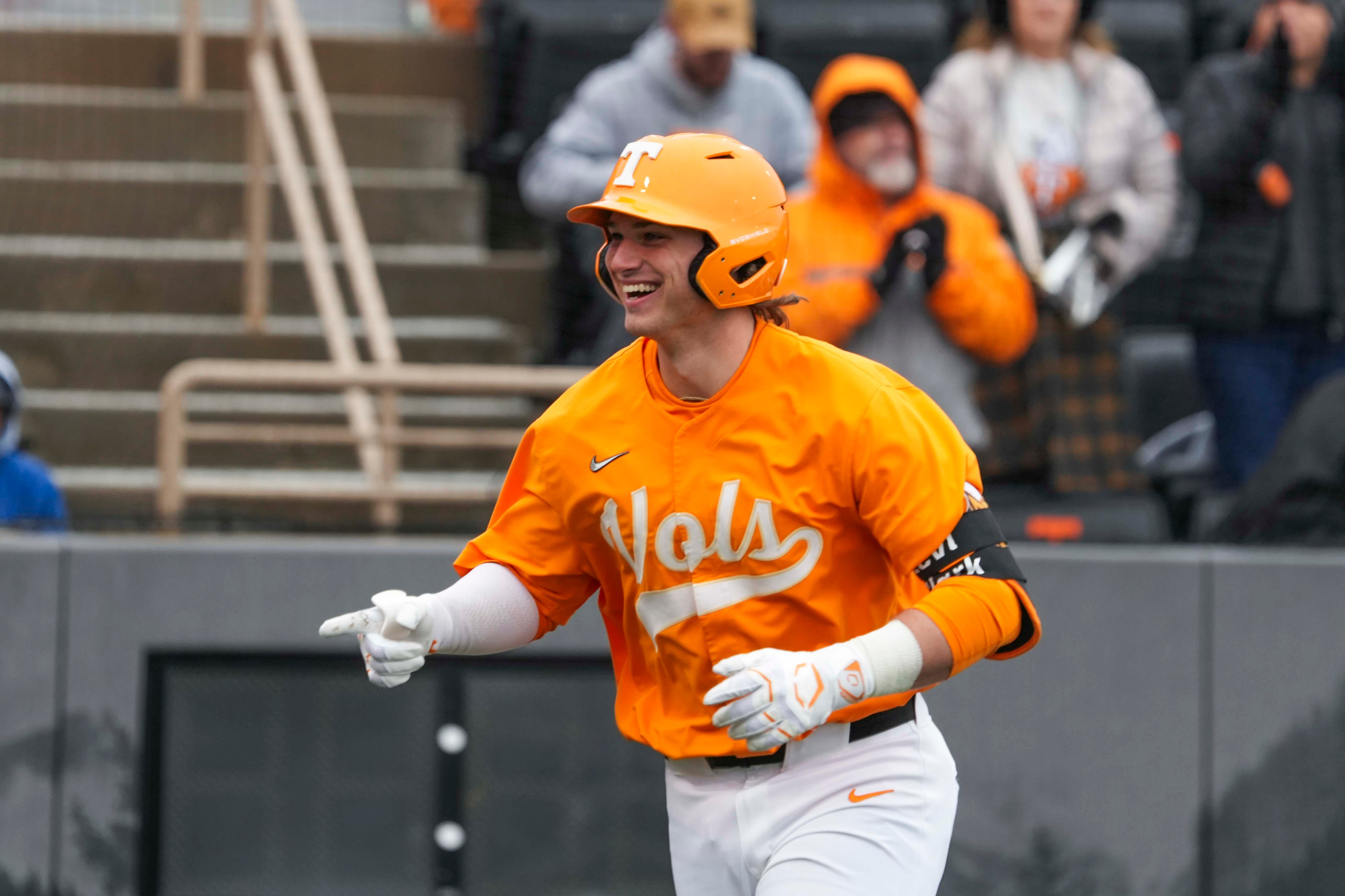 Tennessee catcher/infielder Levi Clark (30) celebrates his grand slam with Tennessee infielder Ariel Antigua (2) at a Tennessee baseball game against Samford, in Lindsey Nelson Stadium at University of Tennessee in Knoxville, Tenn., Saturday, Feb. 22, 2025.