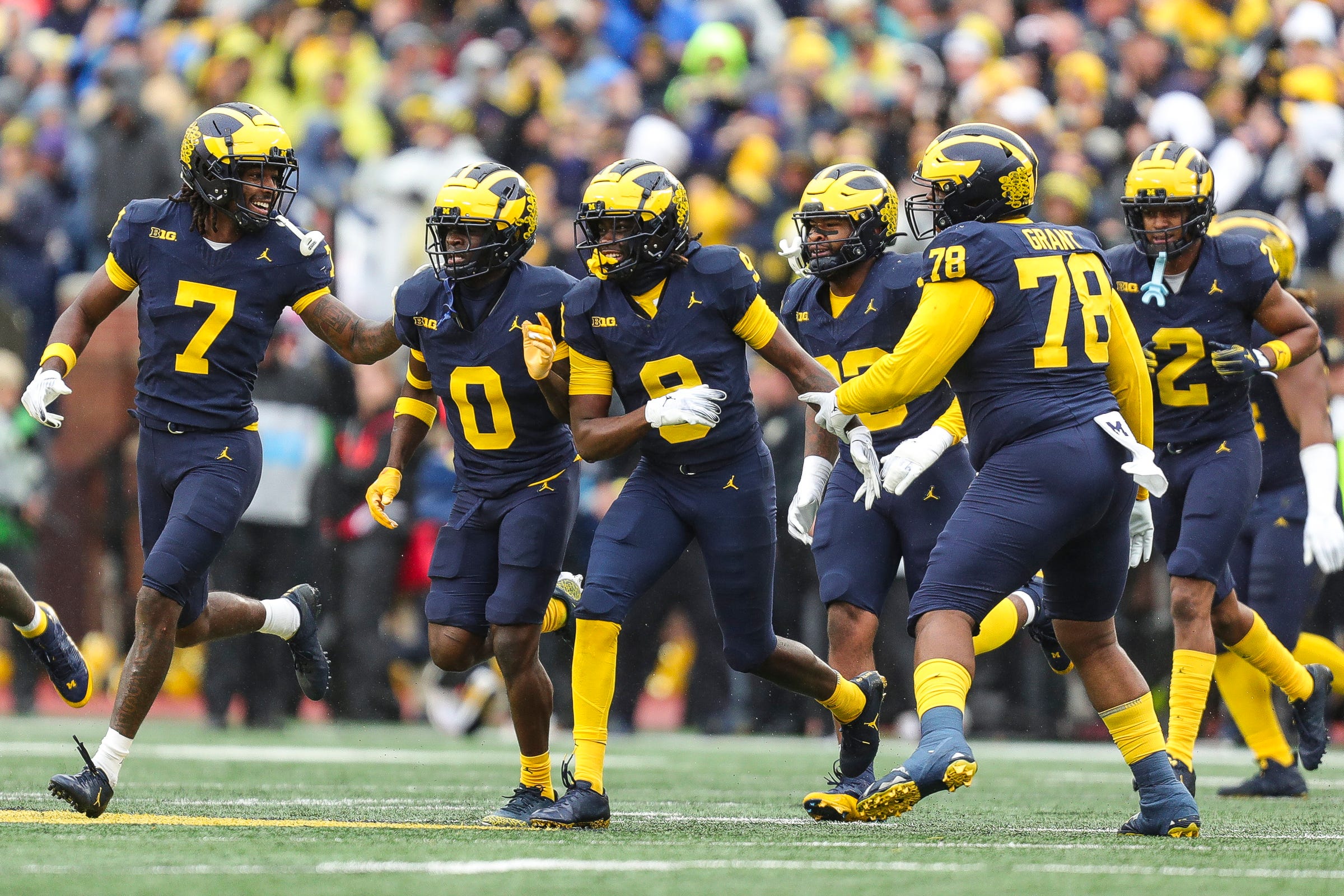 Rod Moore celebrates an interception for Michigan