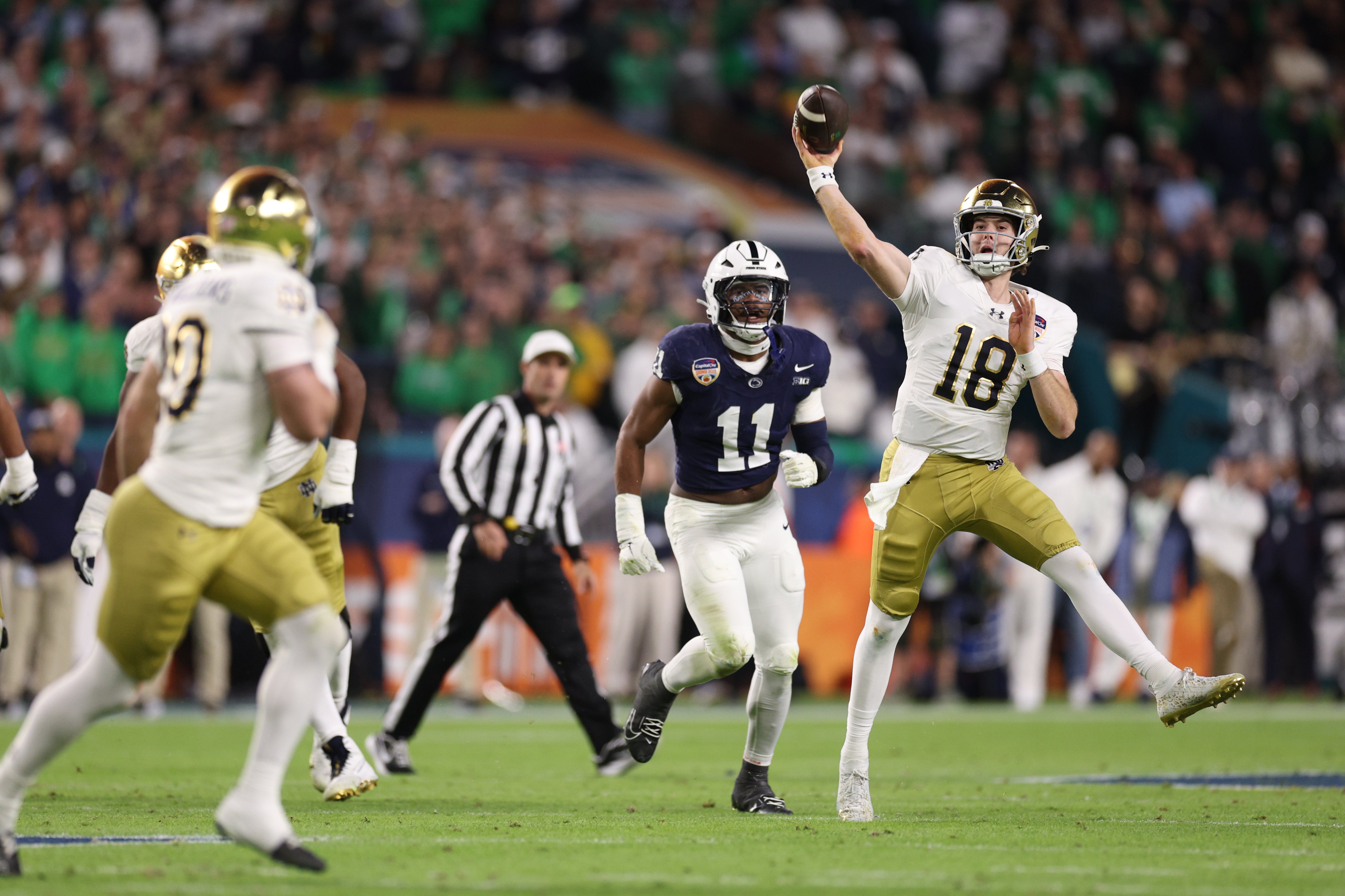 Notre Dame Fighting Irish quarterback Steve Angeli (18) throws the ball in the first half against the Penn State Nittany Lions in the Orange Bowl at Hard Rock Stadium.