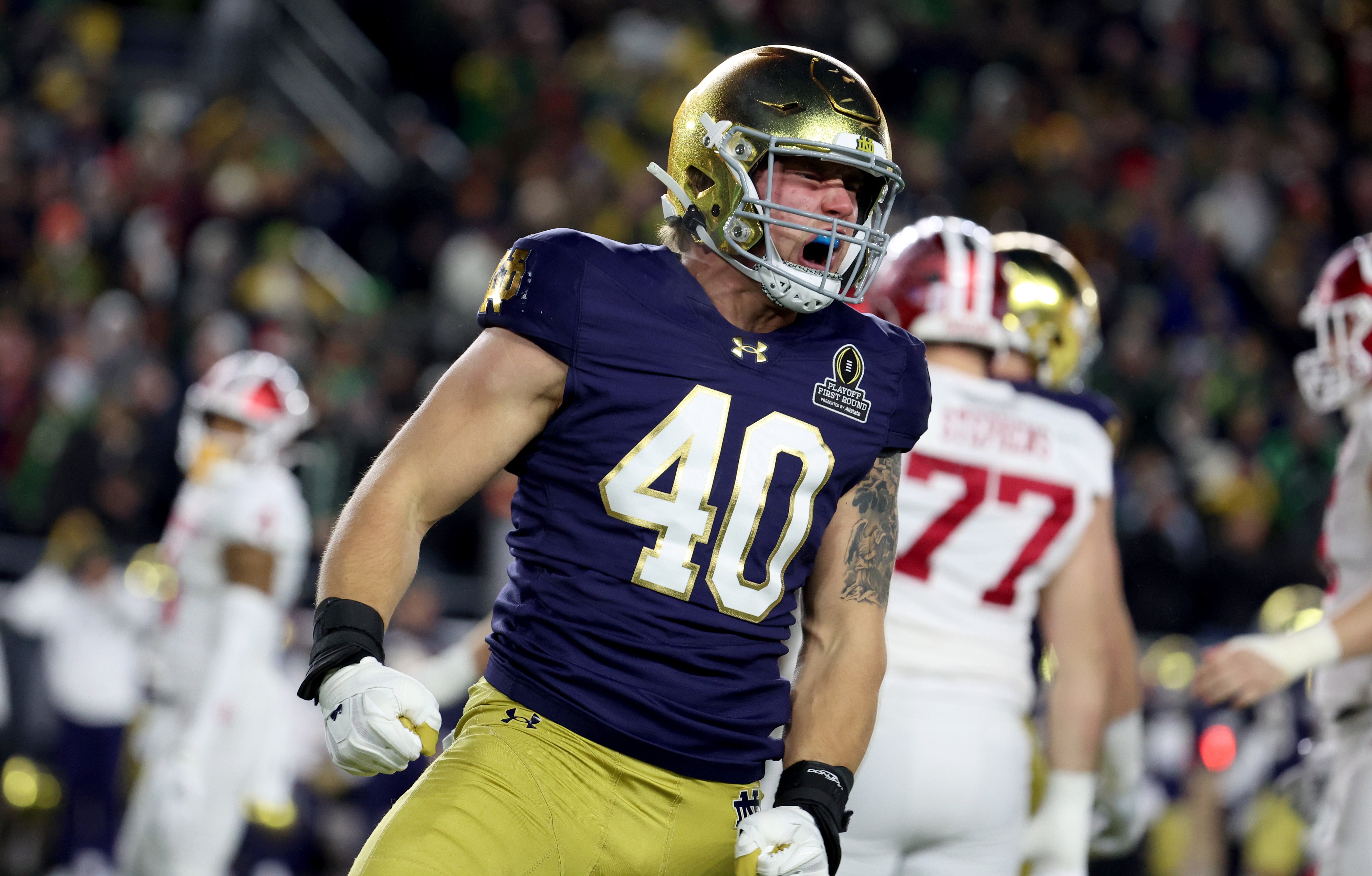 Notre Dame Fighting Irish defensive lineman Joshua Burnham (40) reacts after a play during the first quarter against the Indiana Hoosiers at Notre Dame Stadium. 