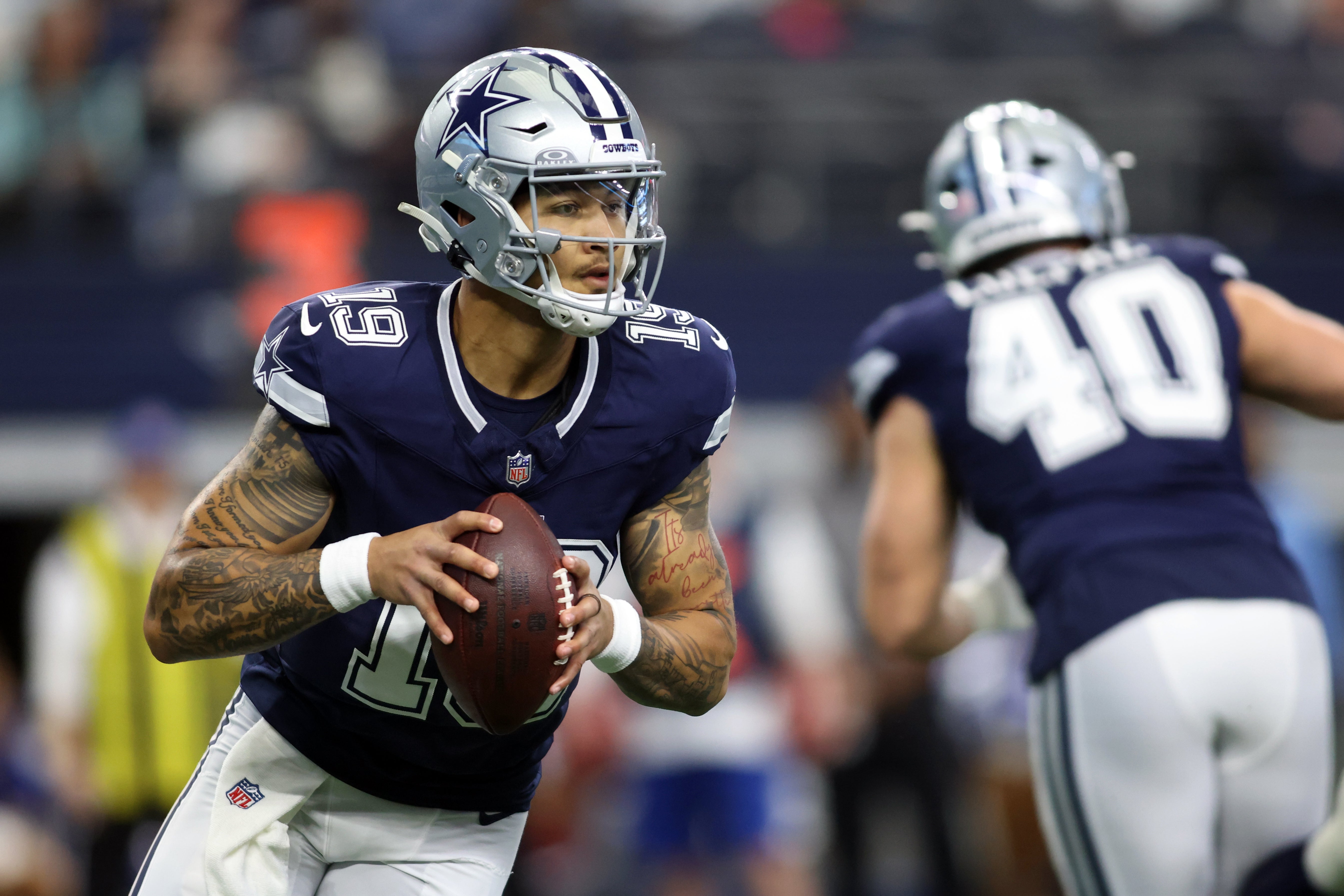Dallas Cowboys quarterback Trey Lance (19) throws a pass against the Washington Commanders during the first quarter at AT&T Stadium.