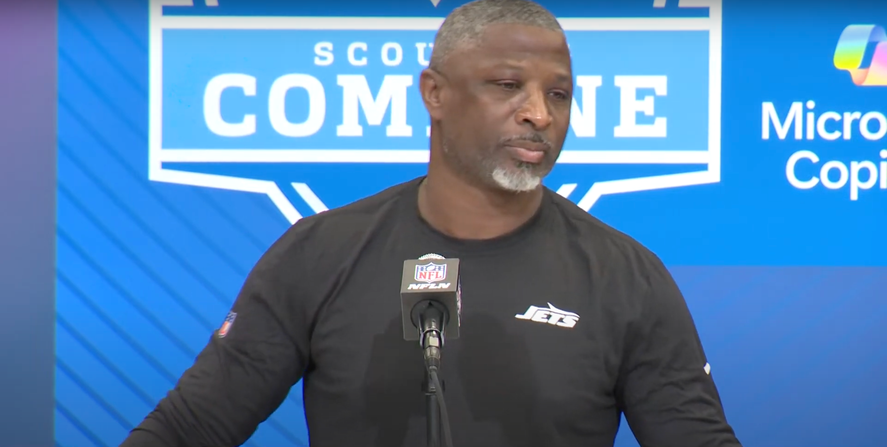 Aaron Glenn speaks with reporters at the 2025 NFL Combine.