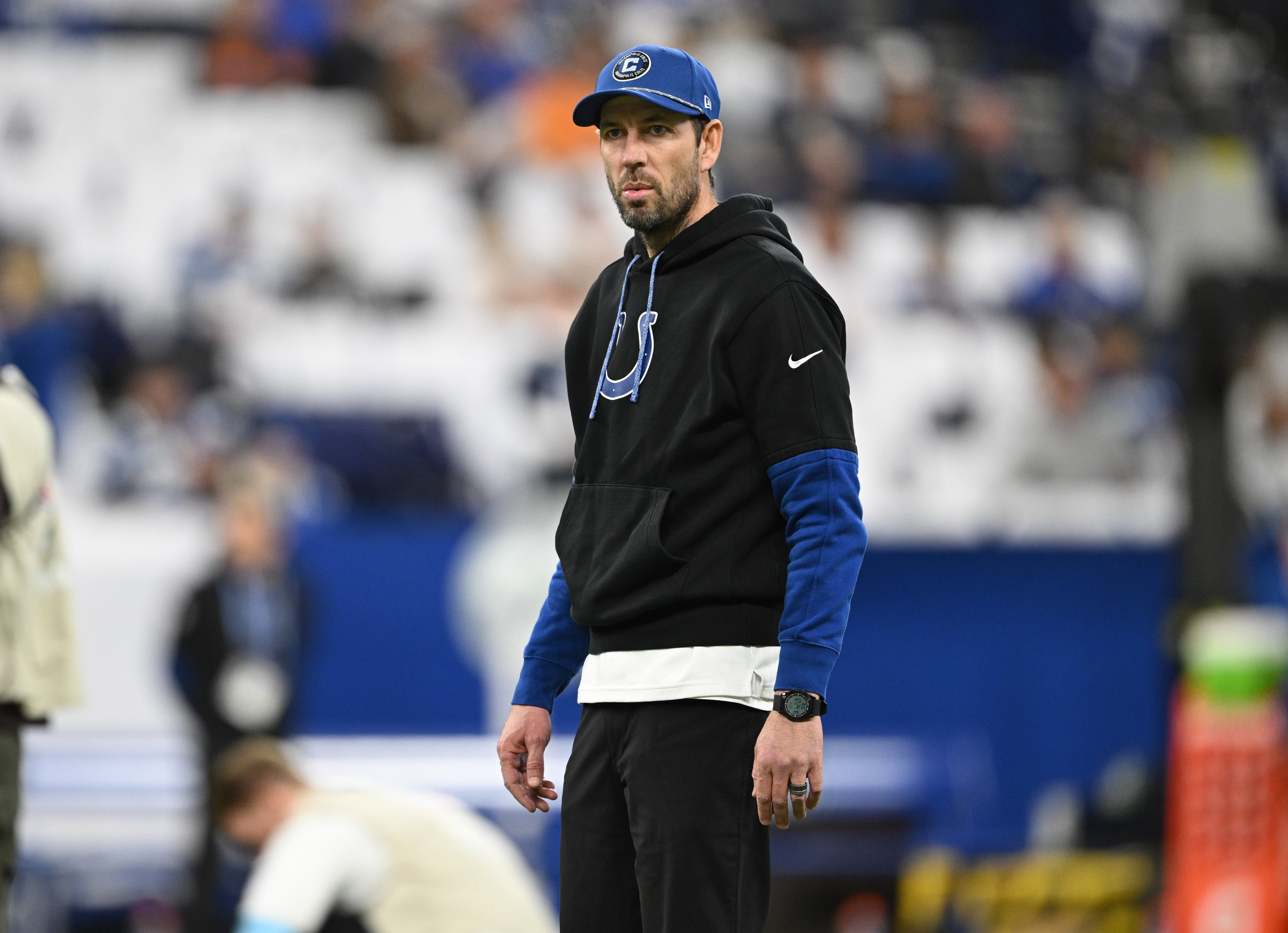 Dec 22, 2024; Indianapolis, Indiana, USA; Indianapolis Colts head coach Shane Steichen stands on the field during warm ups before the game against the Tennessee Titans at Lucas Oil Stadium.