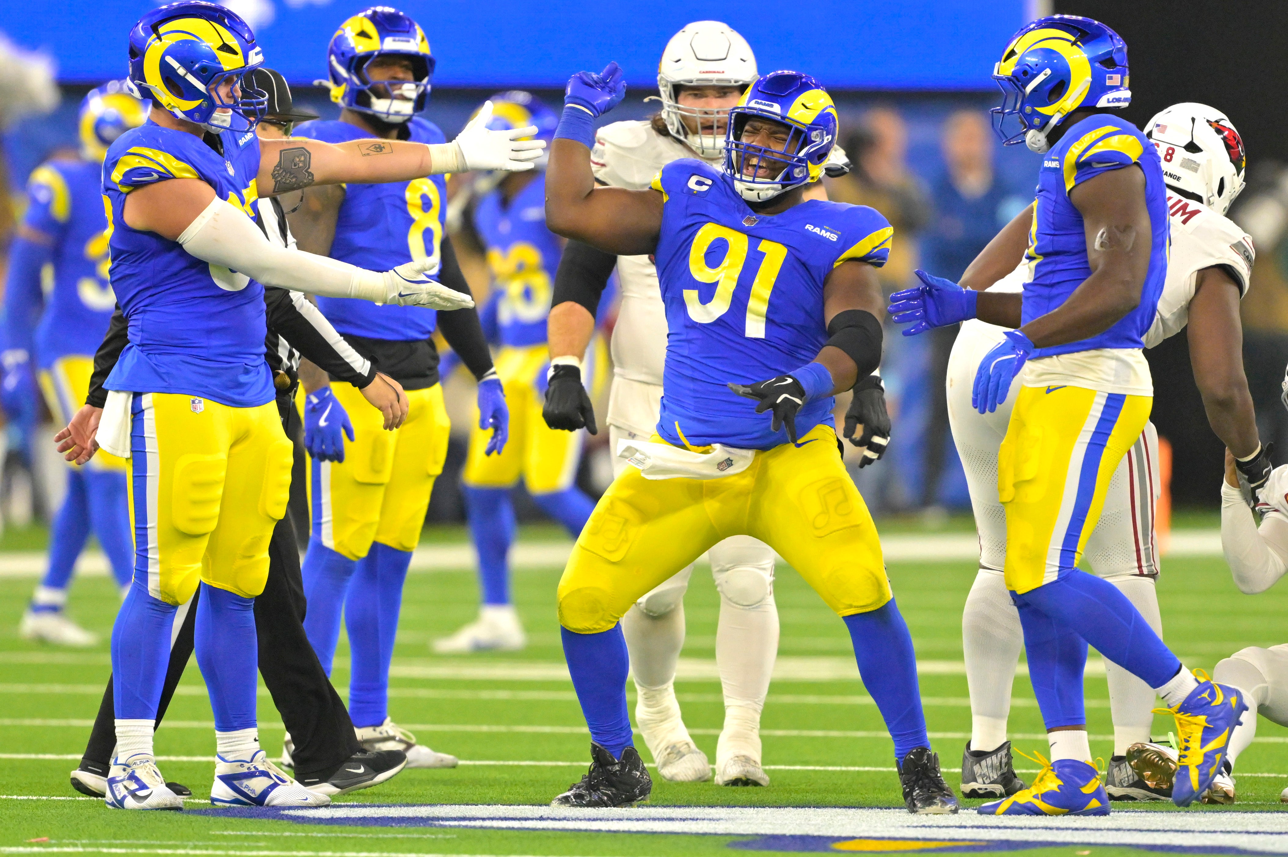 Dec 28, 2024; Inglewood, California, USA; Los Angeles Rams defensive tackle Kobie Turner (91) celebrates after sackiing Arizona Cardinals quarterback Kyler Murray (1) in the second half at SoFi Stadium.