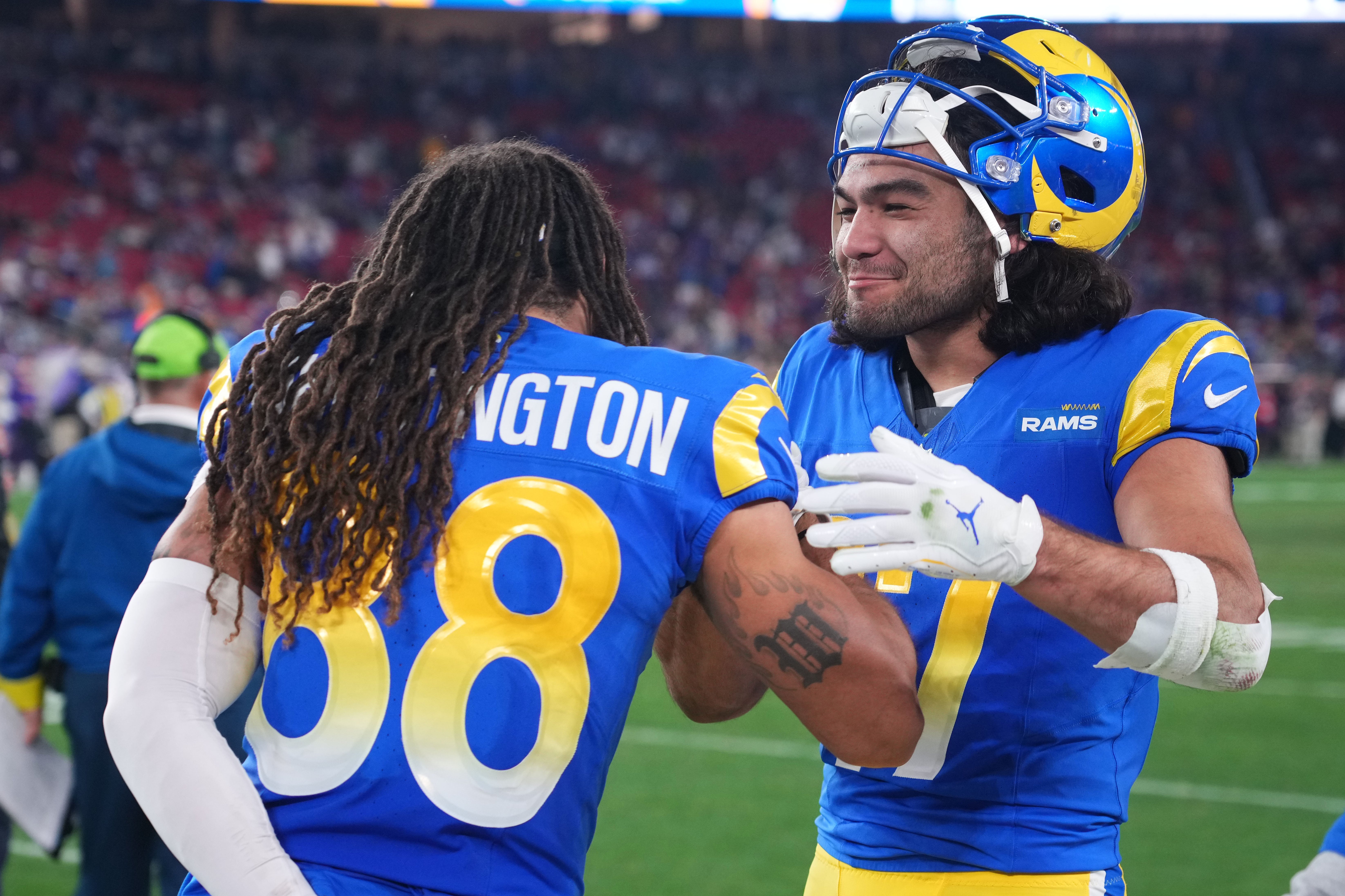 Jan 13, 2025; Glendale, AZ, USA; Los Angeles Rams wide receiver Puka Nacua (17) reacts with wide receiver Jordan Whittington (88) during the second half against the Minnesota Vikings in an NFC wild card game at State Farm Stadium.