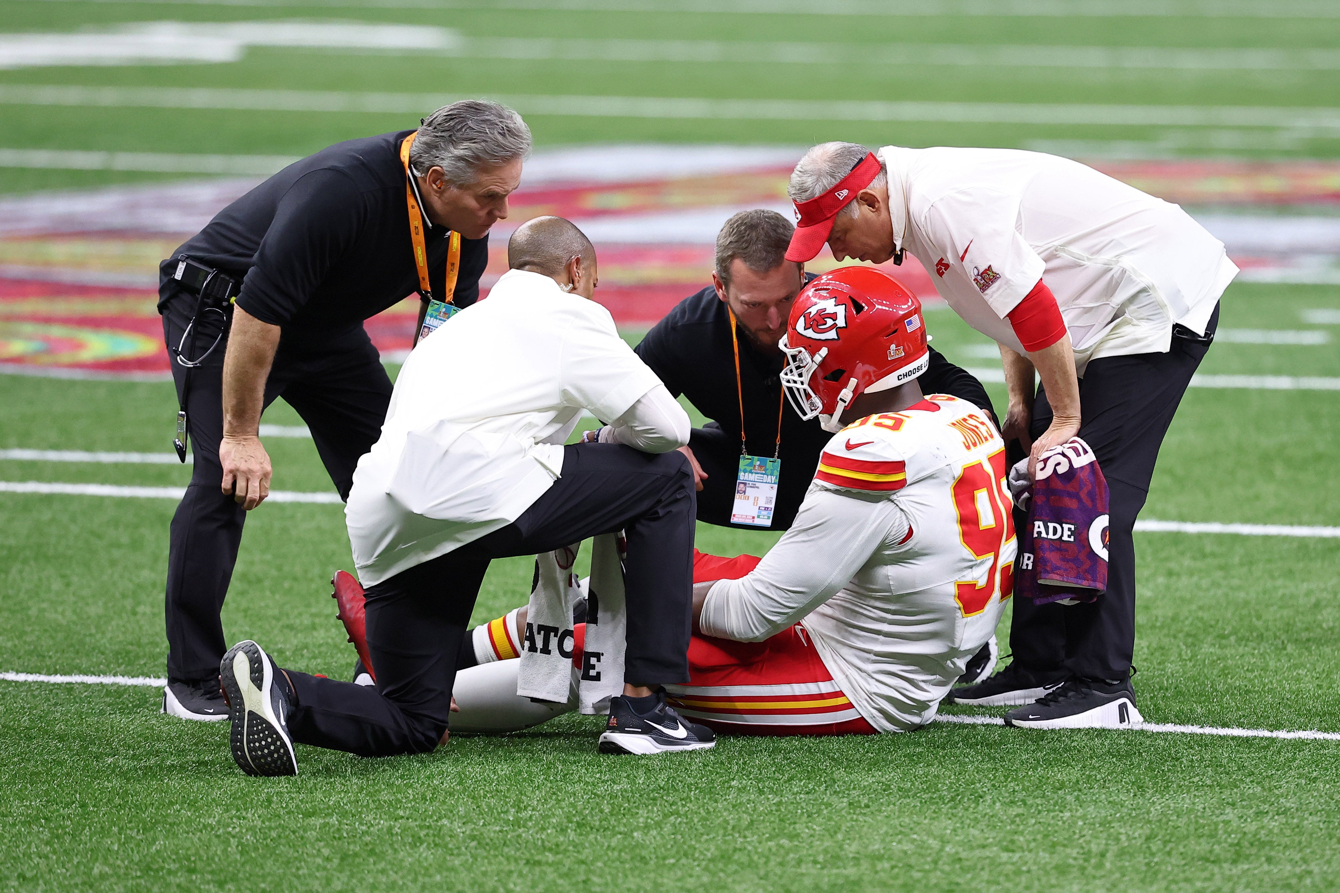 Feb 9, 2025; New Orleans, LA, USA; Kansas City Chiefs defensive tackle Chris Jones (95) is helped after an apparent injury against the Philadelphia Eagles during the second half of Super Bowl LIX at Caesars Superdome.