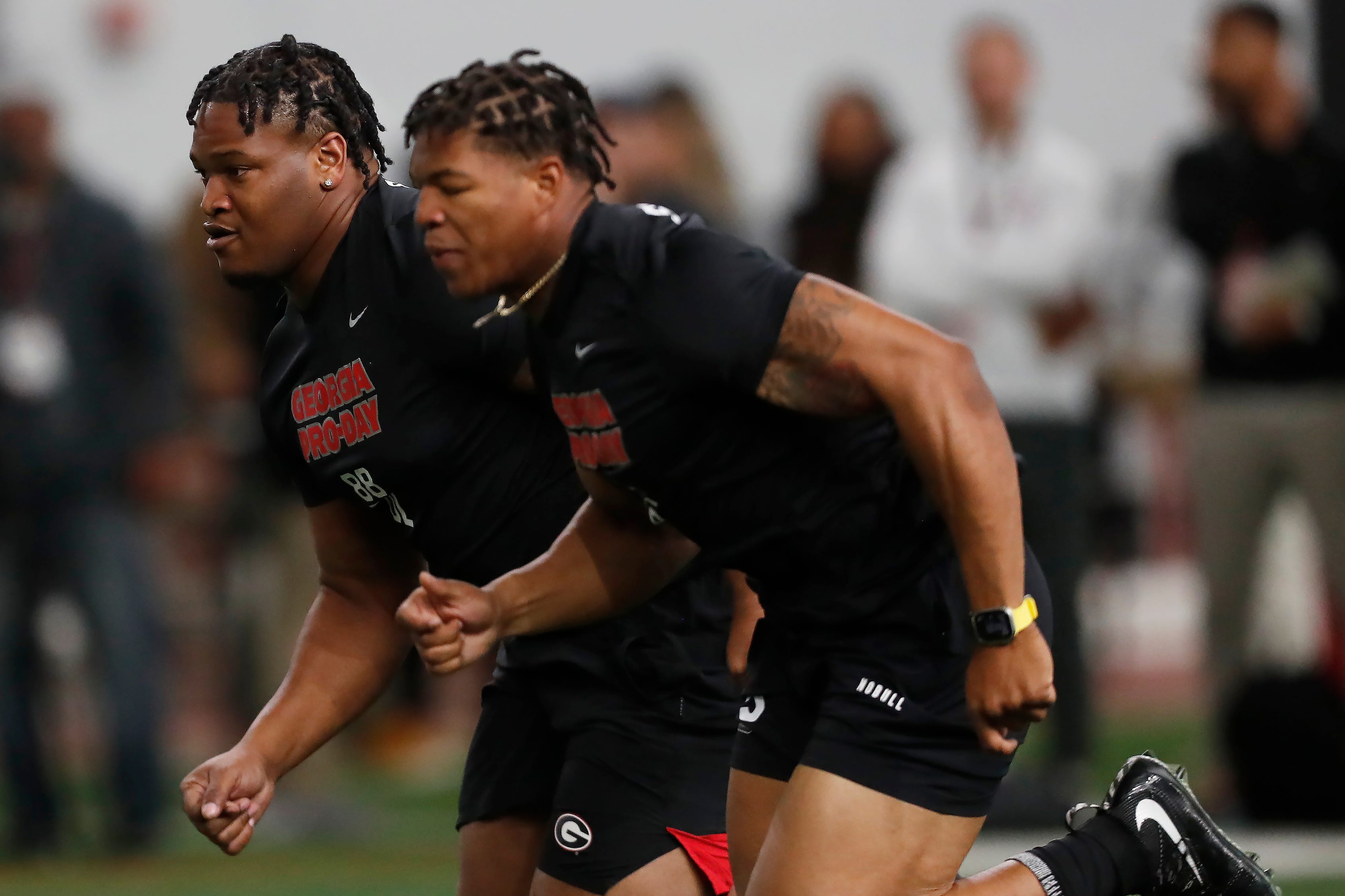 Georgia defensive lineman Jalen Carter (88) and Georgia linebacker Nolan Smith (4) run a drill during UGA Pro Day in Athens, Ga., on Wednesday, March 15, 2023.