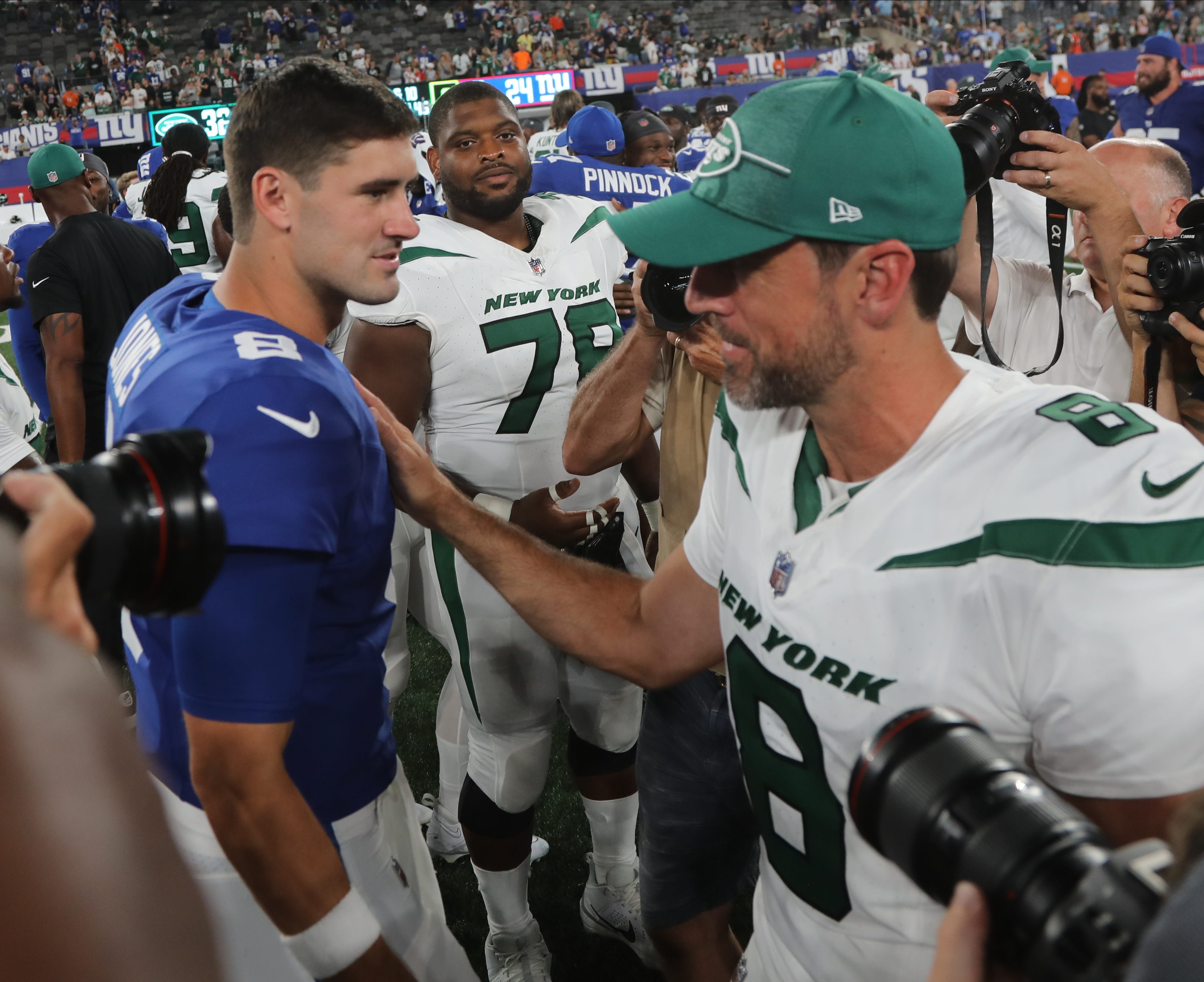 Jets quarterback Aaron Rodgers with NY Giants quarterback Daniel Jones at the end of the game. The NY Jets against the NY Giants on August 26, 2023 at MetLife Stadium in East Rutherford, NJ, as the rivals play their final preseason game before the start of the NFL season.