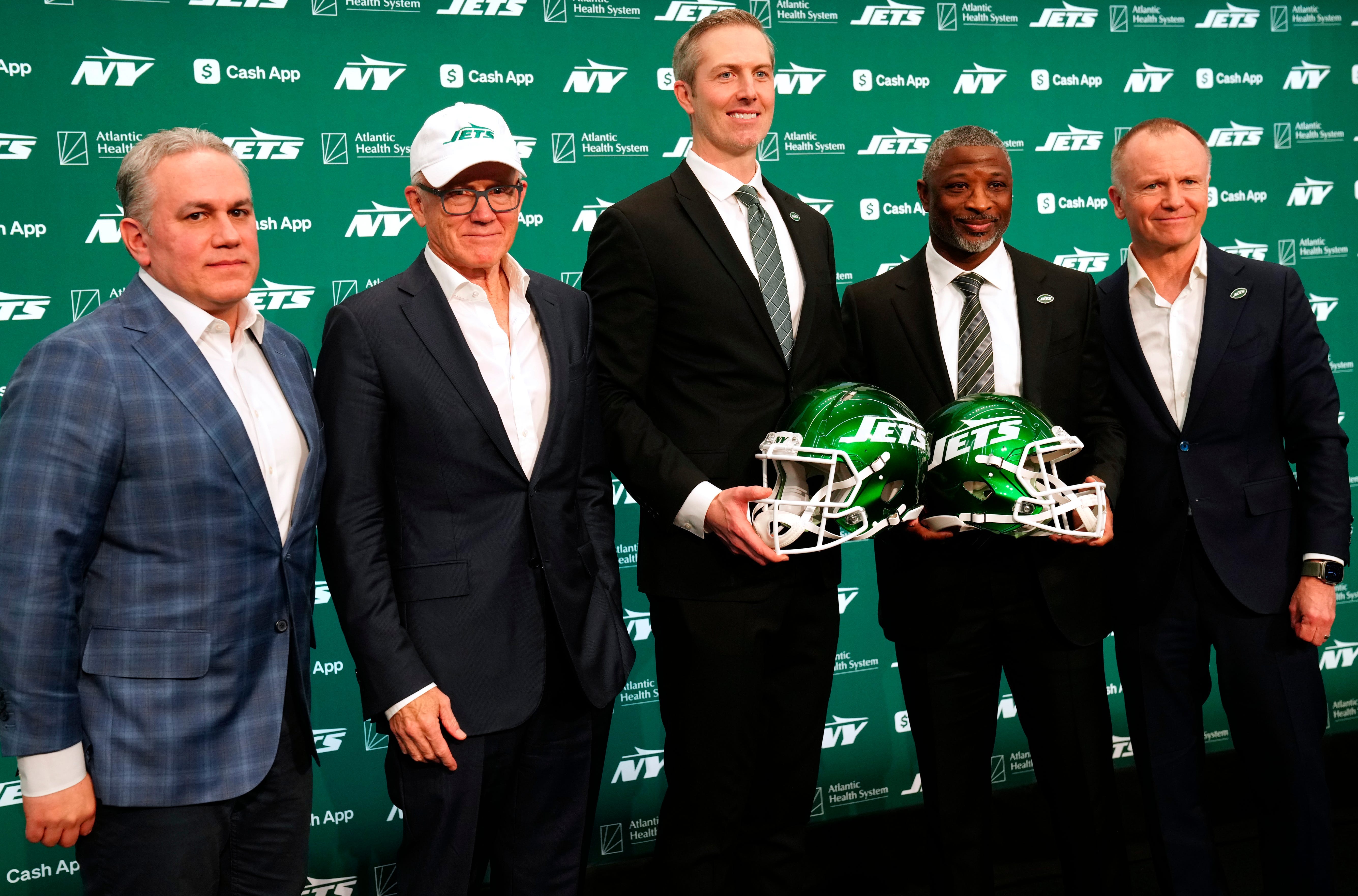 New York Jets President, Hymie Elhai, owner, Woody Johnson, general manager, Darren Mougey, head coach, Aaron Glenn and vice chairman, Christopher Johnson, pose for a photograph, Monday, January 27, 2025, in Florham Park.