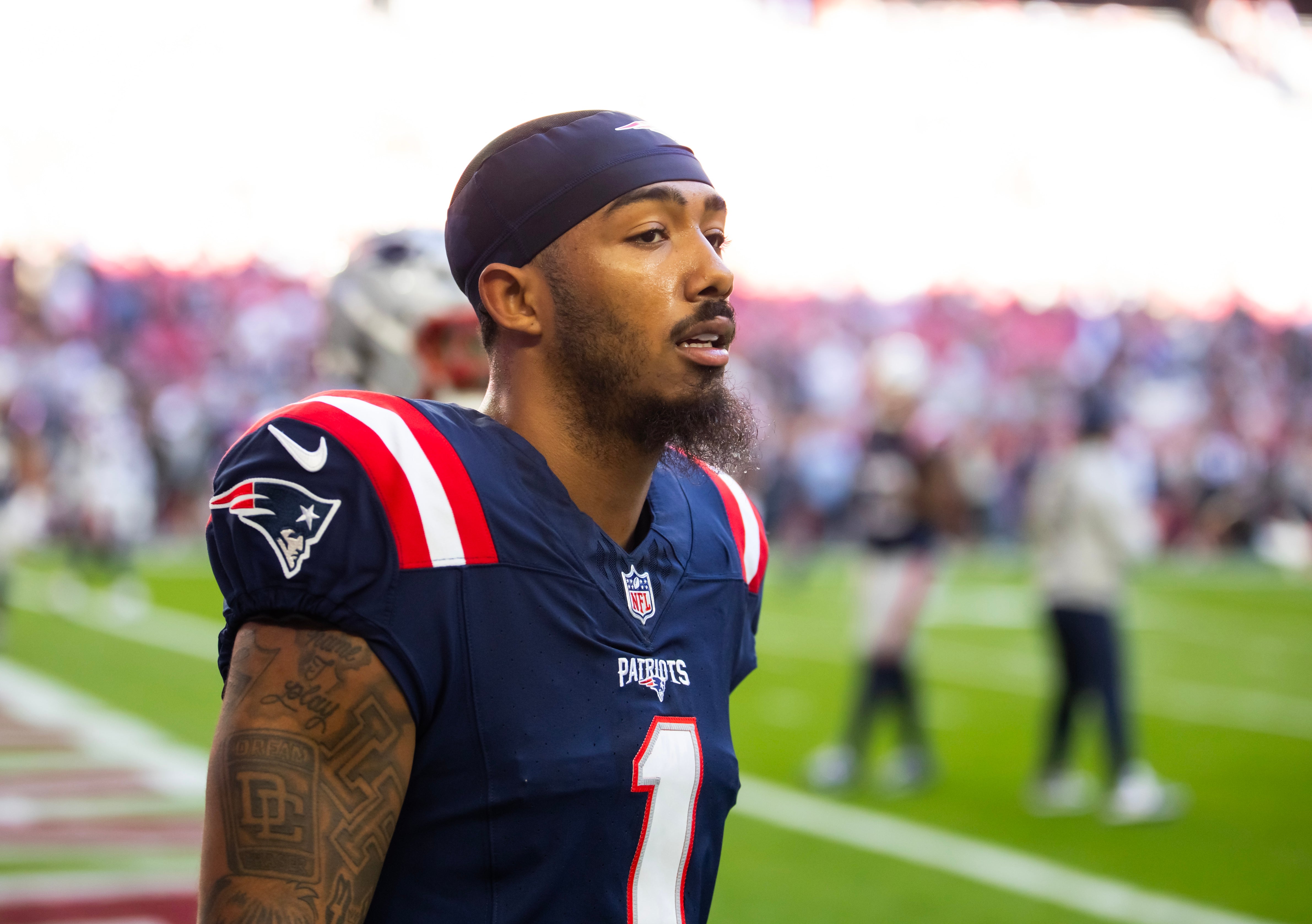 Dec 15, 2024; Glendale, Arizona, USA; New England Patriots wide receiver Ja'Lynn Polk (1) against the Arizona Cardinals at State Farm Stadium.