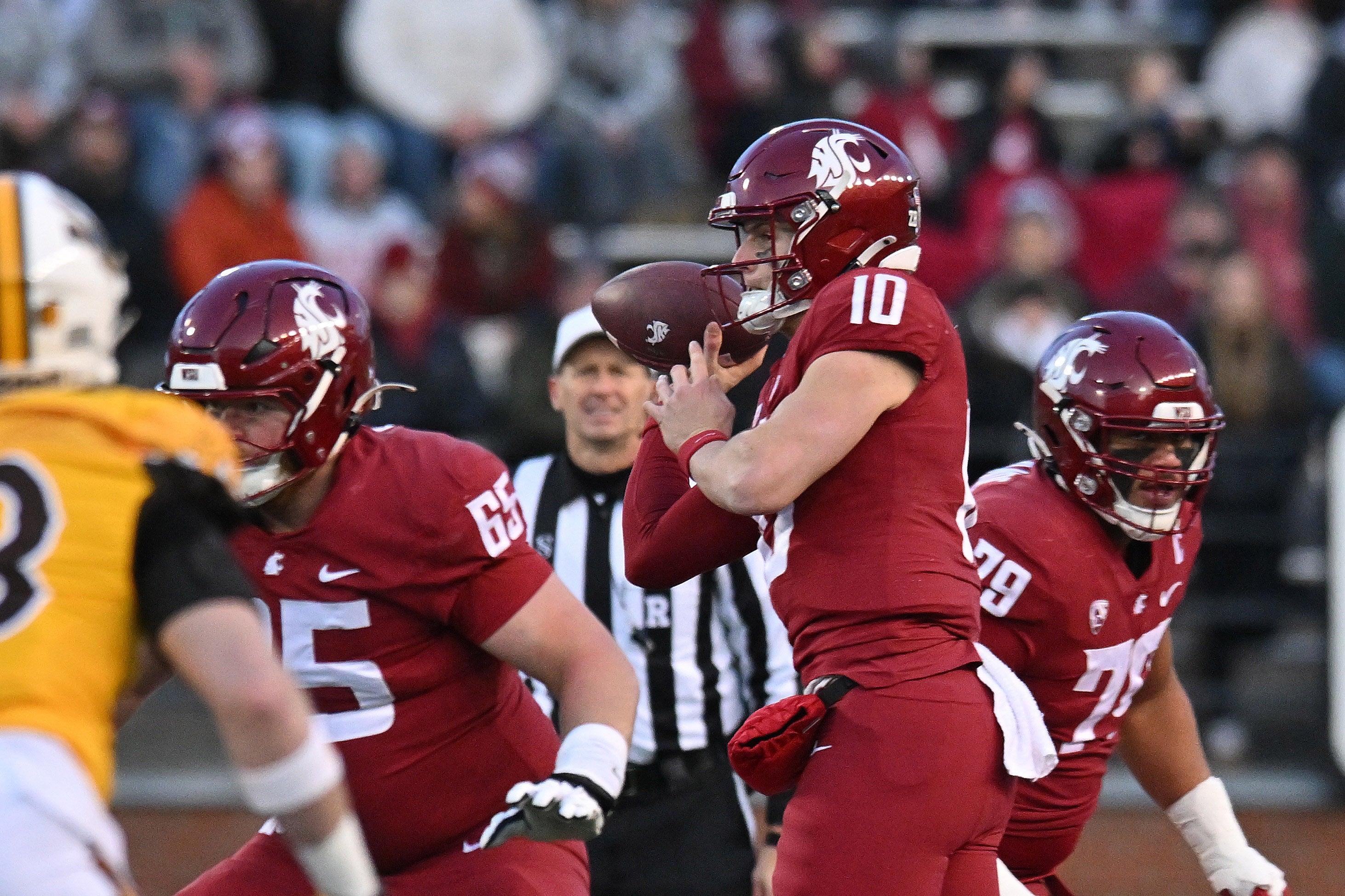 Nov 30, 2024; Pullman, Washington, USA; Washington State Cougars quarterback John Mateer (10) throws a pass against the Wyoming Cowboys in the first half at Gesa Field at Martin Stadium.