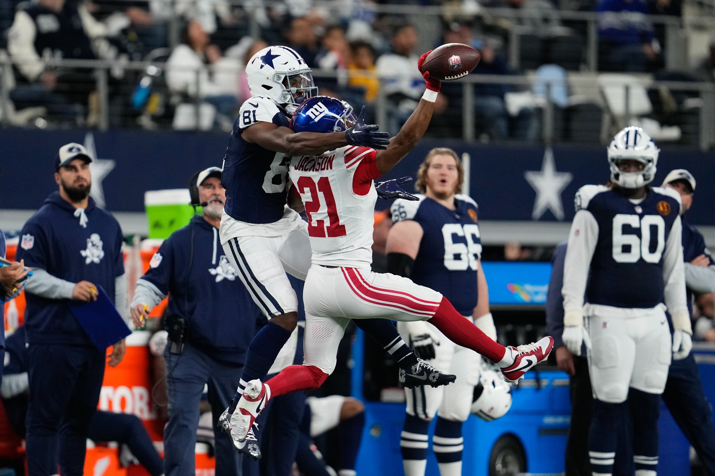 New York Giants cornerback Adoree' Jackson (21) breaks up a pass intended for Dallas Cowboys wide receiver Jonathan Mingo (81) during the first half at AT&T Stadium.