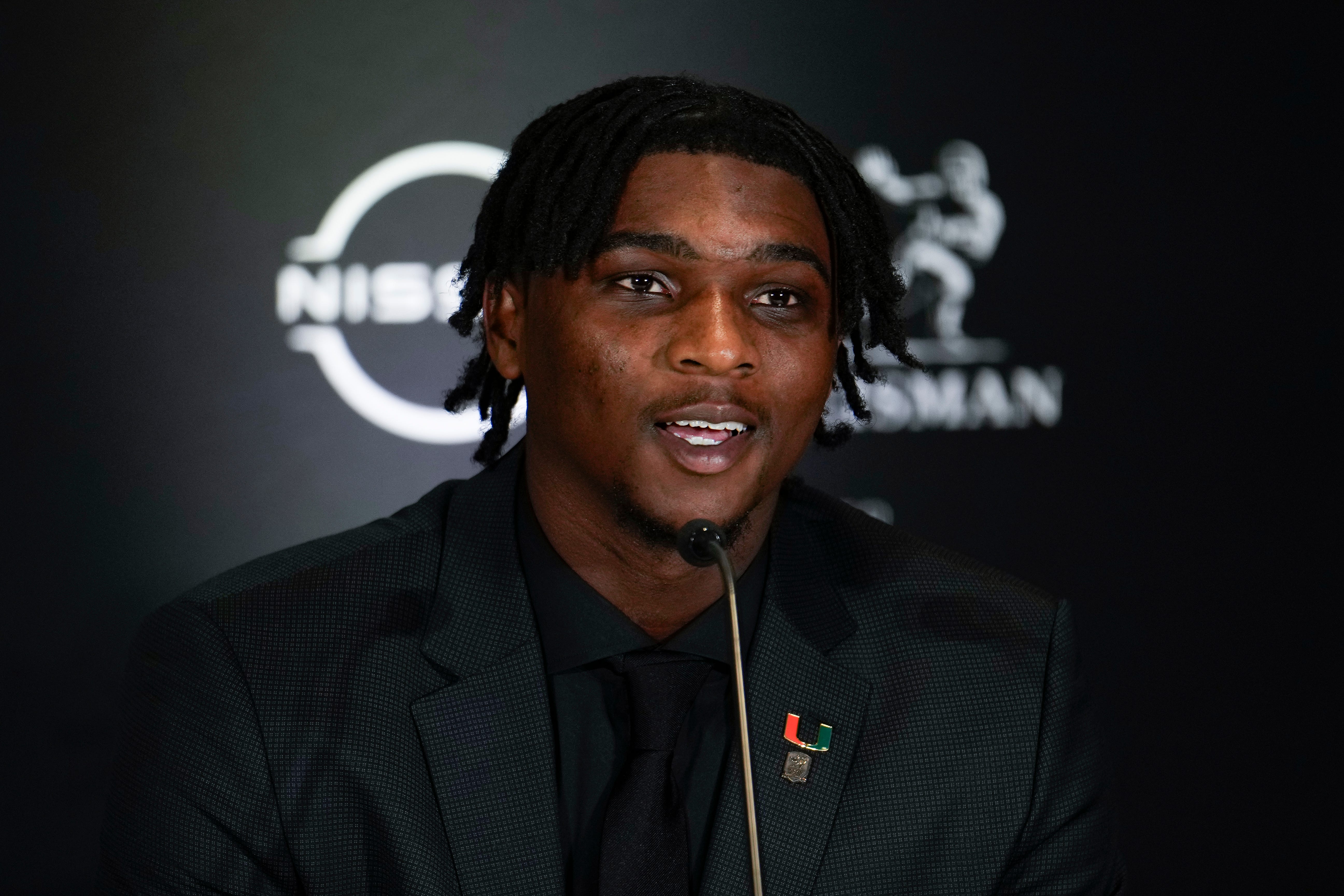 Dec 14, 2024; New York, NY, USA; Miami Hurricanes quarterback Cam Ward speaks on stage during a press conference before the 2024 Heisman Trophy Presentation. Mandatory Credit: Lucas Boland-Imagn Images