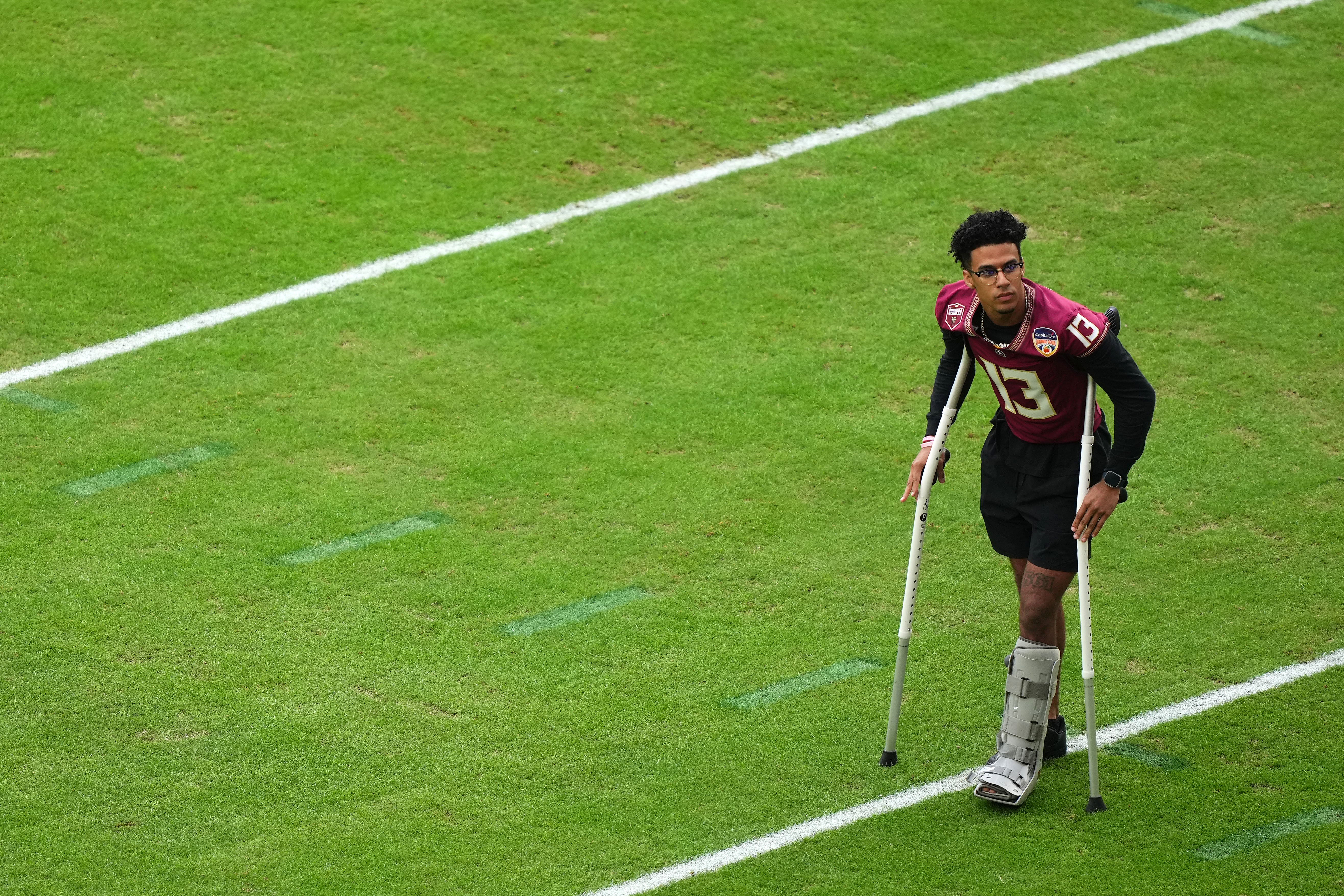 Florida State Seminoles quarterback Jordan Travis (13) before the 2023 Orange Bowl against the Georgia Bulldogs at Hard Rock Stadium.