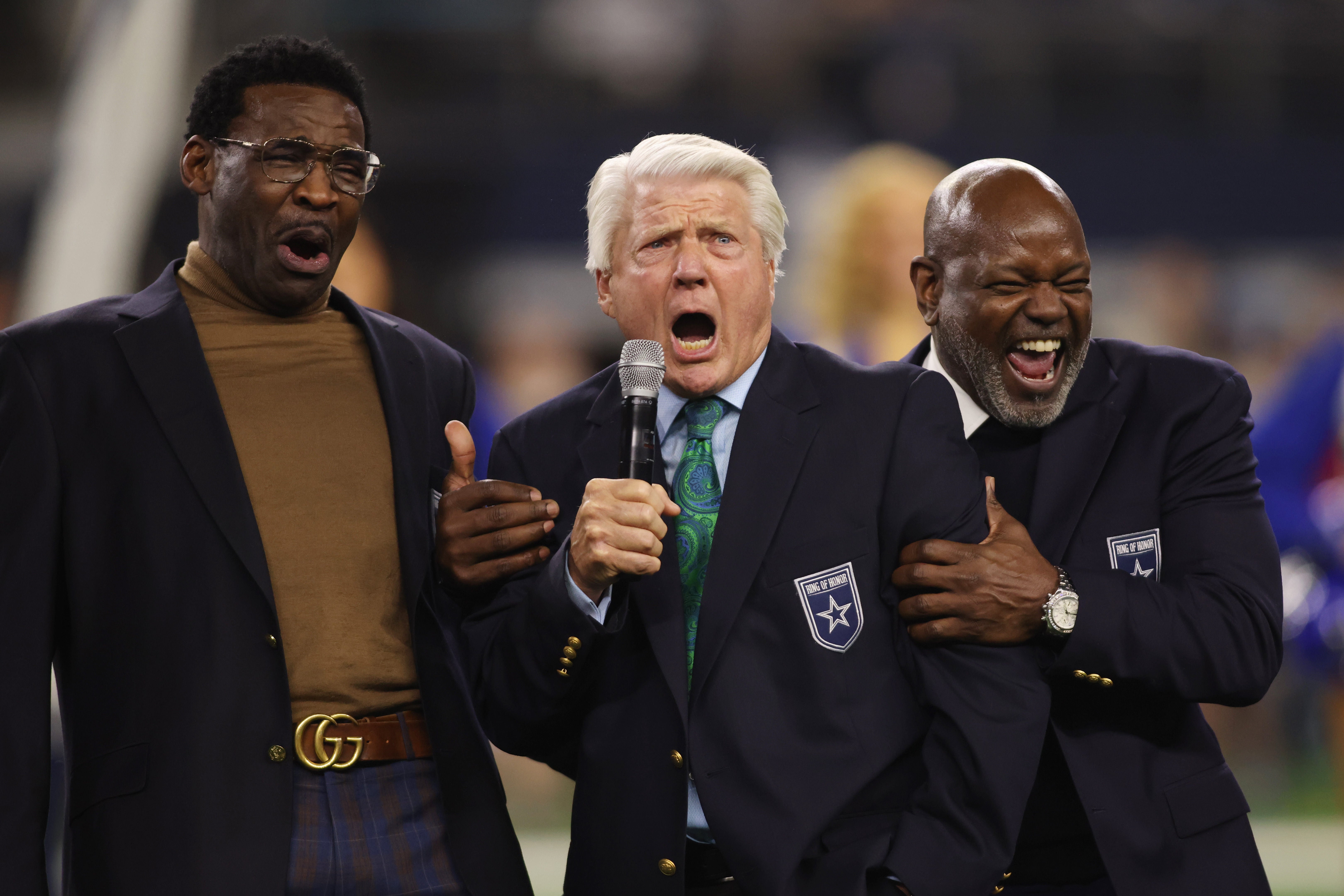 Former Dallas Cowboys Michael Irvin, Jimmy Johnson and Emmitt Smith react during the Ring of Honor ceremony at the half time of the game against the Detroit Lions at AT&T Stadium.