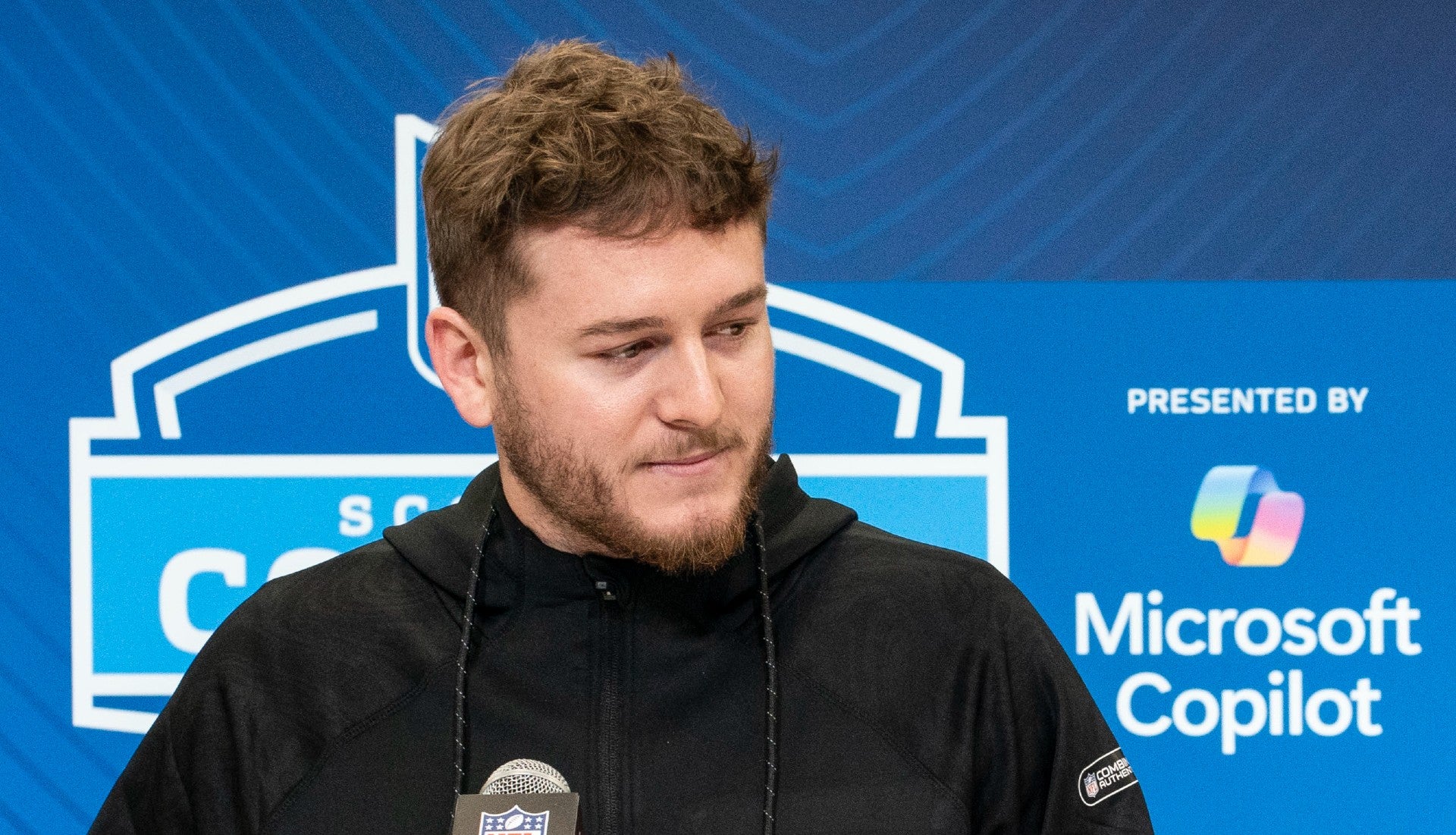 Feb 28, 2025; Indianapolis, IN, USA; Texas quarterback Quinn Ewers (QB04) answers questions at a press conference during the 2025 NFL Combine at Indiana Convention Center.
