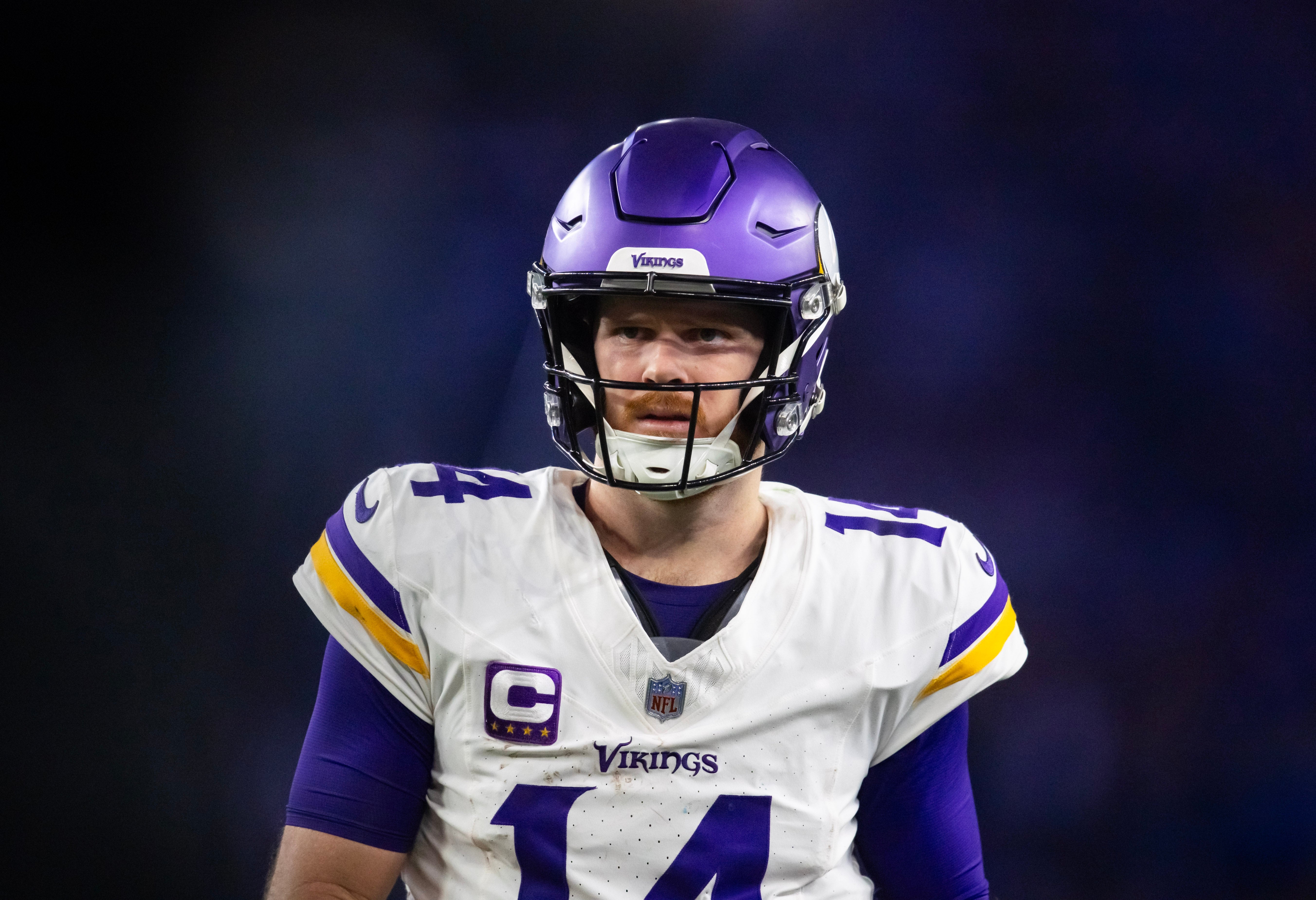 Jan 13, 2025; Glendale, AZ, USA; Minnesota Vikings quarterback Sam Darnold (14) against the Los Angeles Rams during an NFC wild card game at State Farm Stadium. Mandatory Credit: Mark J. Rebilas-Imagn Images