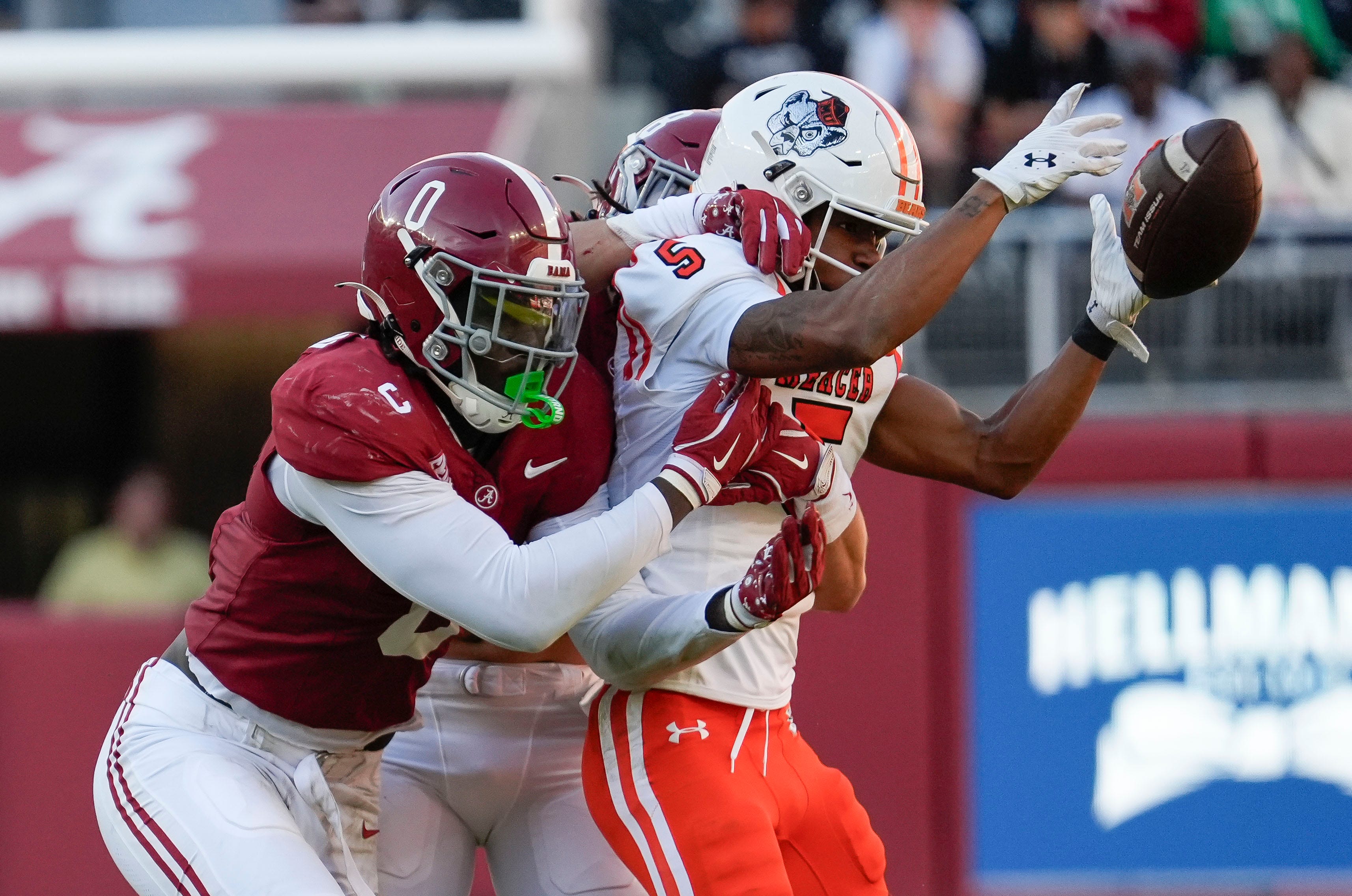 Nov 16, 2024; Tuscaloosa, AL, USA; Alabama Crimson Tide linebacker Deontae Lawson (0) and Alabama Crimson Tide defensive back DeVonta Smith (8) break up a pass intended for Mercer wide receiver Javarius George (5) at Bryant-Denny Stadium. Alabama defeated Mercer 52-7.