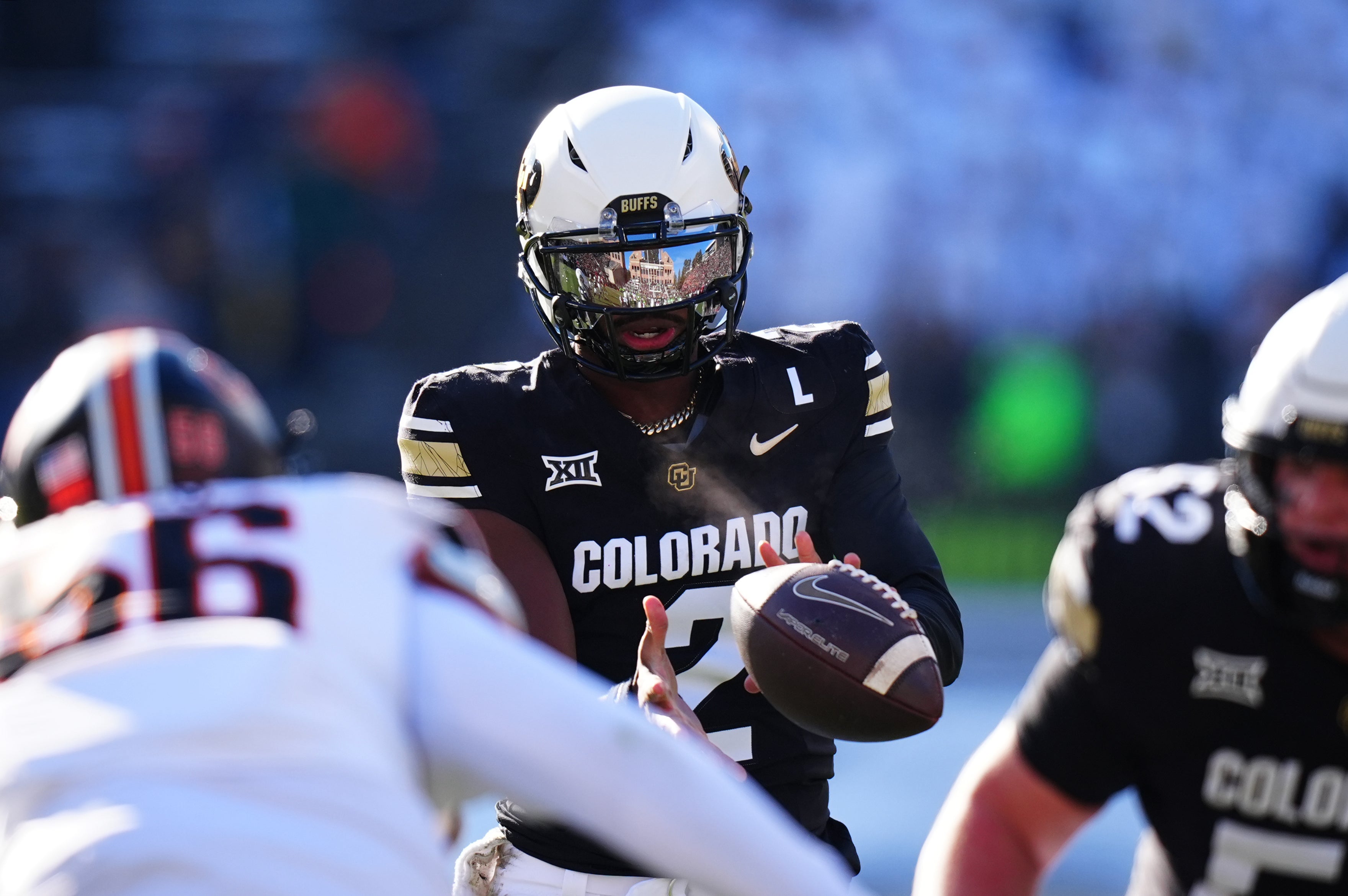 Nov 29, 2024; Boulder, Colorado, USA; Colorado Buffaloes quarterback Shedeur Sanders (2) takes a hike in the first quarter against the Oklahoma State Cowboys at Folsom Field.