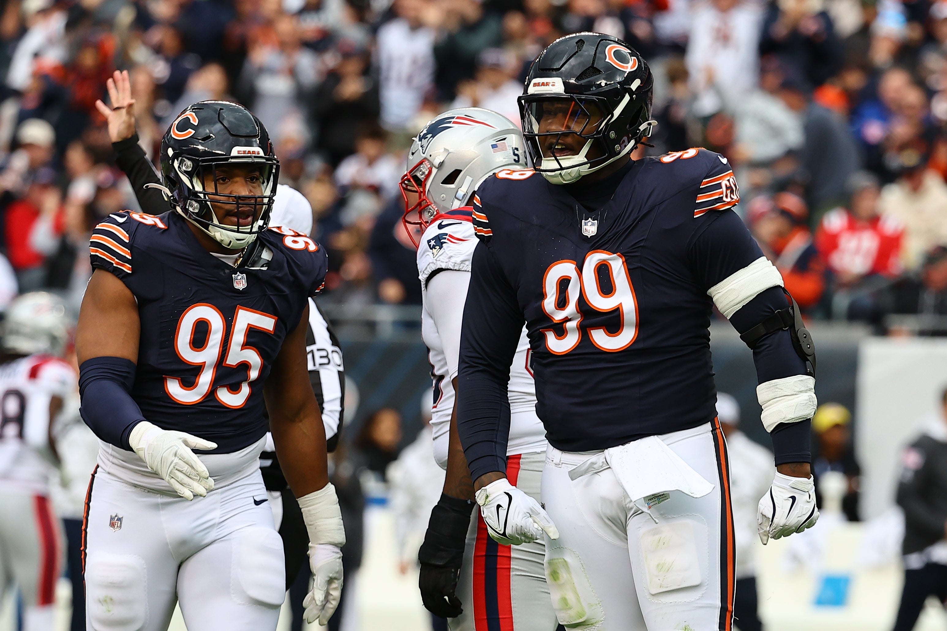 Nov 10, 2024; Chicago, Illinois, USA; Chicago Bears defensive tackle Gervon Dexter Sr. (99) reacts against the New England Patriots during the first quarter at Soldier Field.