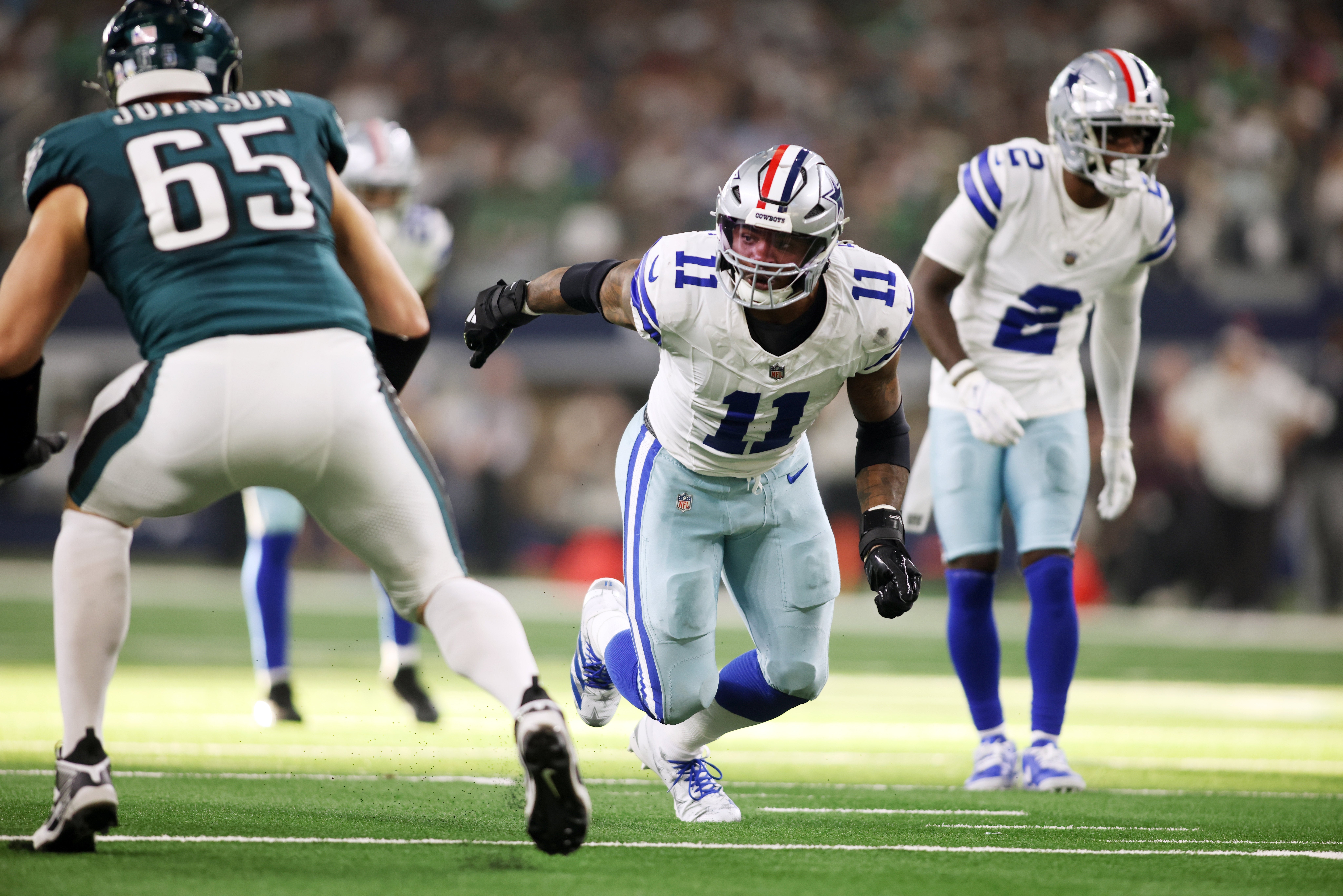 Dallas Cowboys linebacker Micah Parsons (11) rushes the passer in the game against the Philadelphia Eagles at AT&T Stadium.