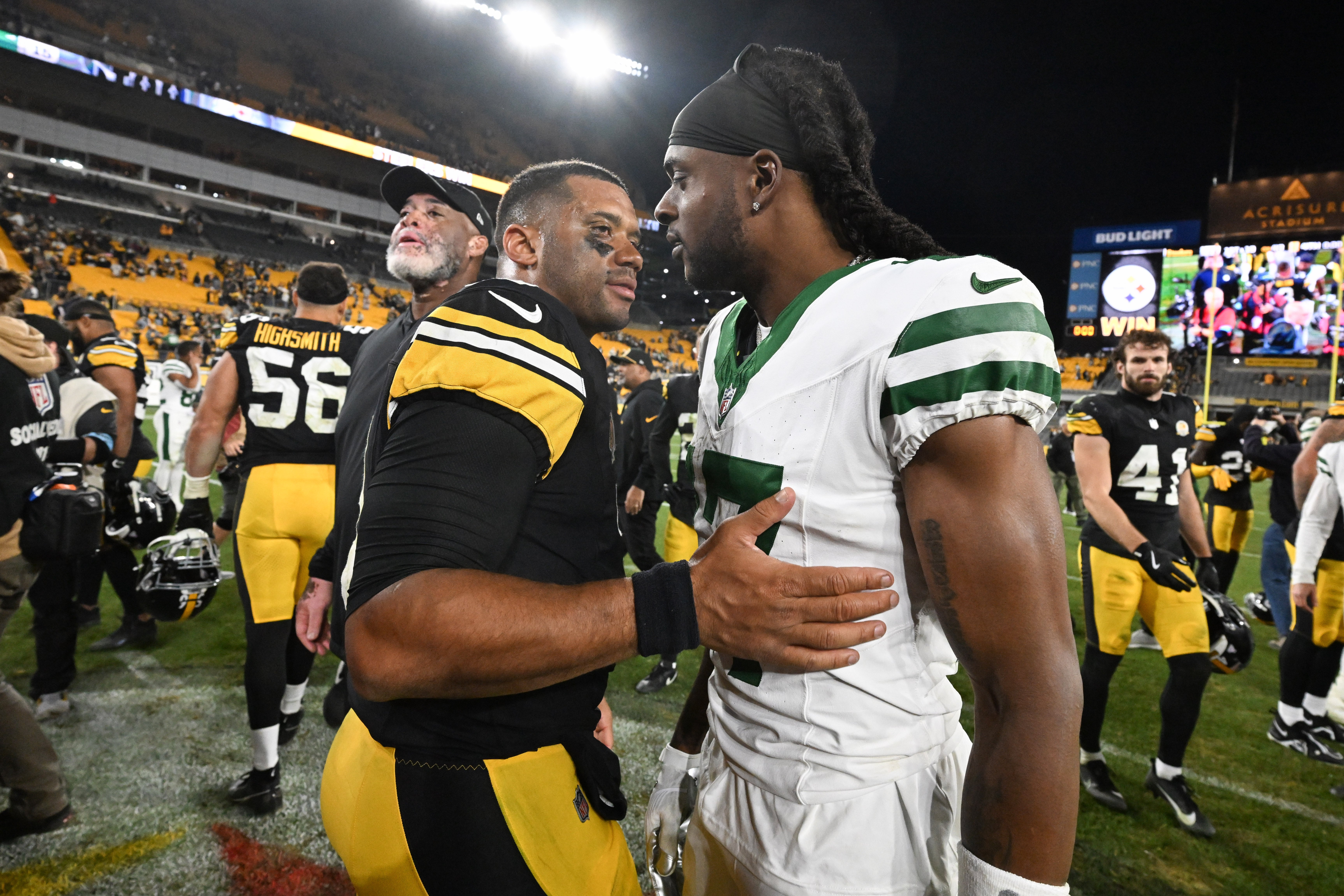Oct 20, 2024; Pittsburgh, Pennsylvania, USA; Pittsburgh Steelers quarterback Russell Wilson (3) greets New York Jets wide receiver Davante Adams (17) following their game at Acrisure Stadium.