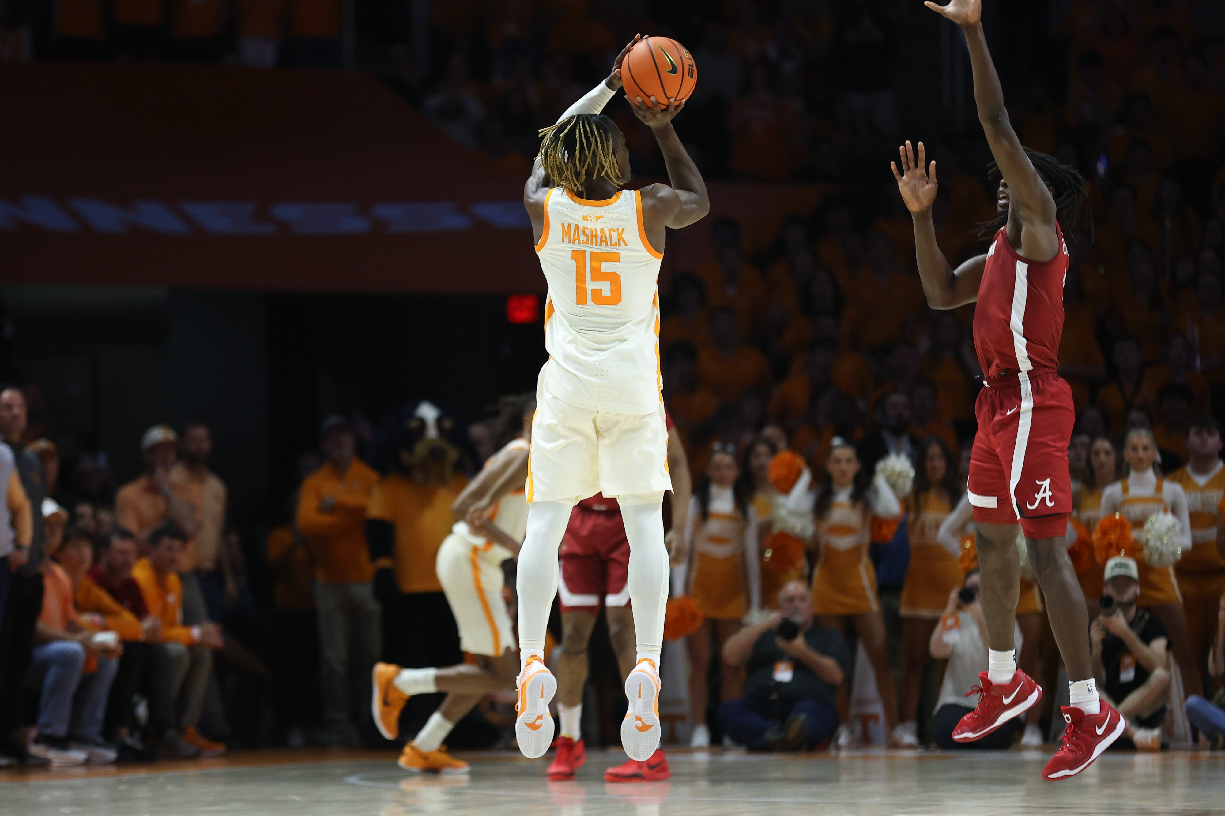 Mar 1, 2025; Knoxville, Tennessee, USA; Tennessee Volunteers guard Jahmai Mashack (15) shoots a game winning three pointer as time expires against the Alabama Crimson Tide at Thompson-Boling Arena at Food City Center.