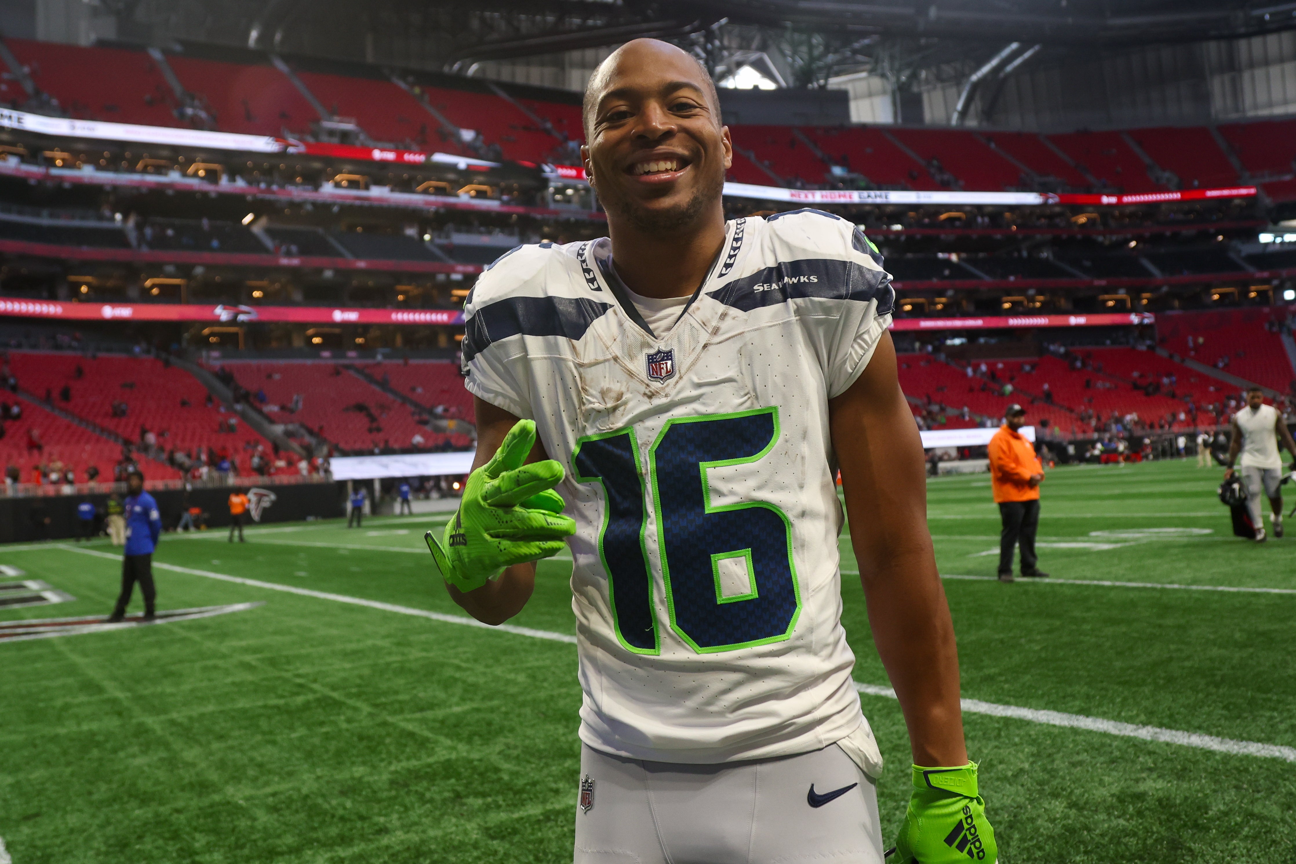 Oct 20, 2024; Atlanta, Georgia, USA; Seattle Seahawks wide receiver Tyler Lockett (16) celebrates after a victory over the Atlanta Falcons at Mercedes-Benz Stadium.