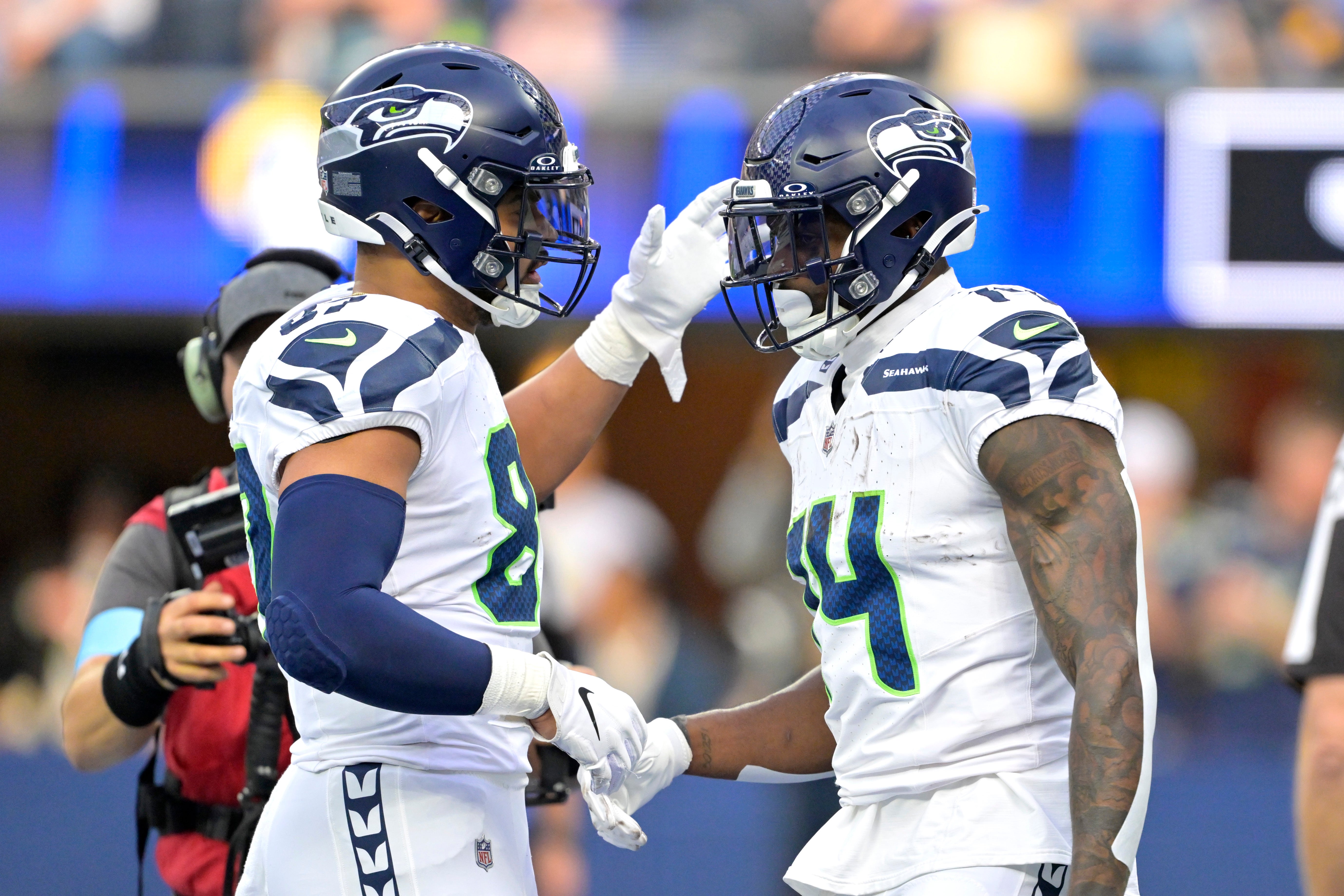 Seahawks wide receiver DK Metcalf (14) is congratulated by tight end Noah Fant (87) after a touchdown