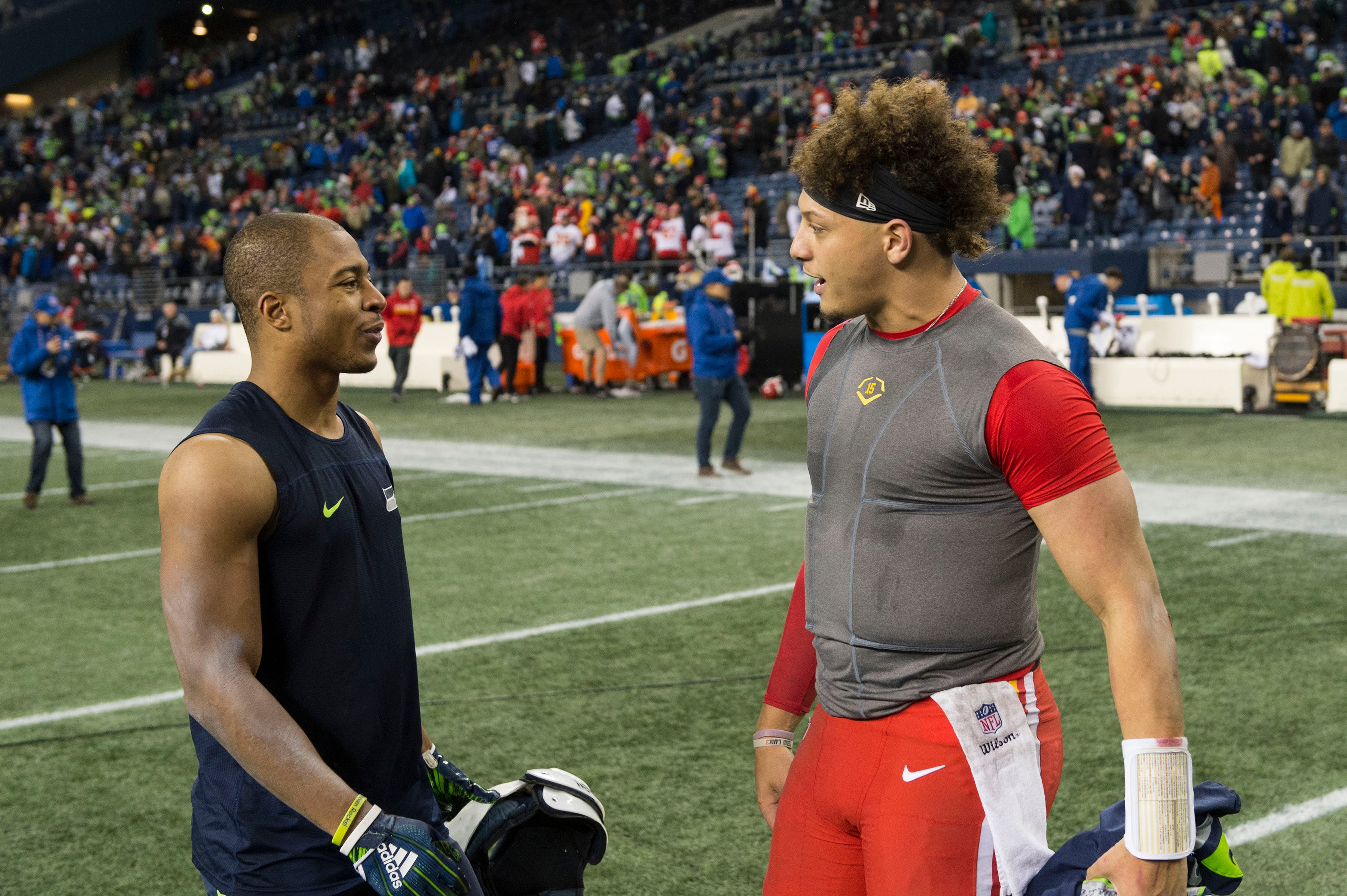 Dec 23, 2018; Seattle, WA, USA; Seattle Seahawks wide receiver Tyler Lockett (16) and Kansas City Chiefs quarterback Patrick Mahomes (15) talk after the game at CenturyLink Field. Seattle defeated Kansas City 38-31.