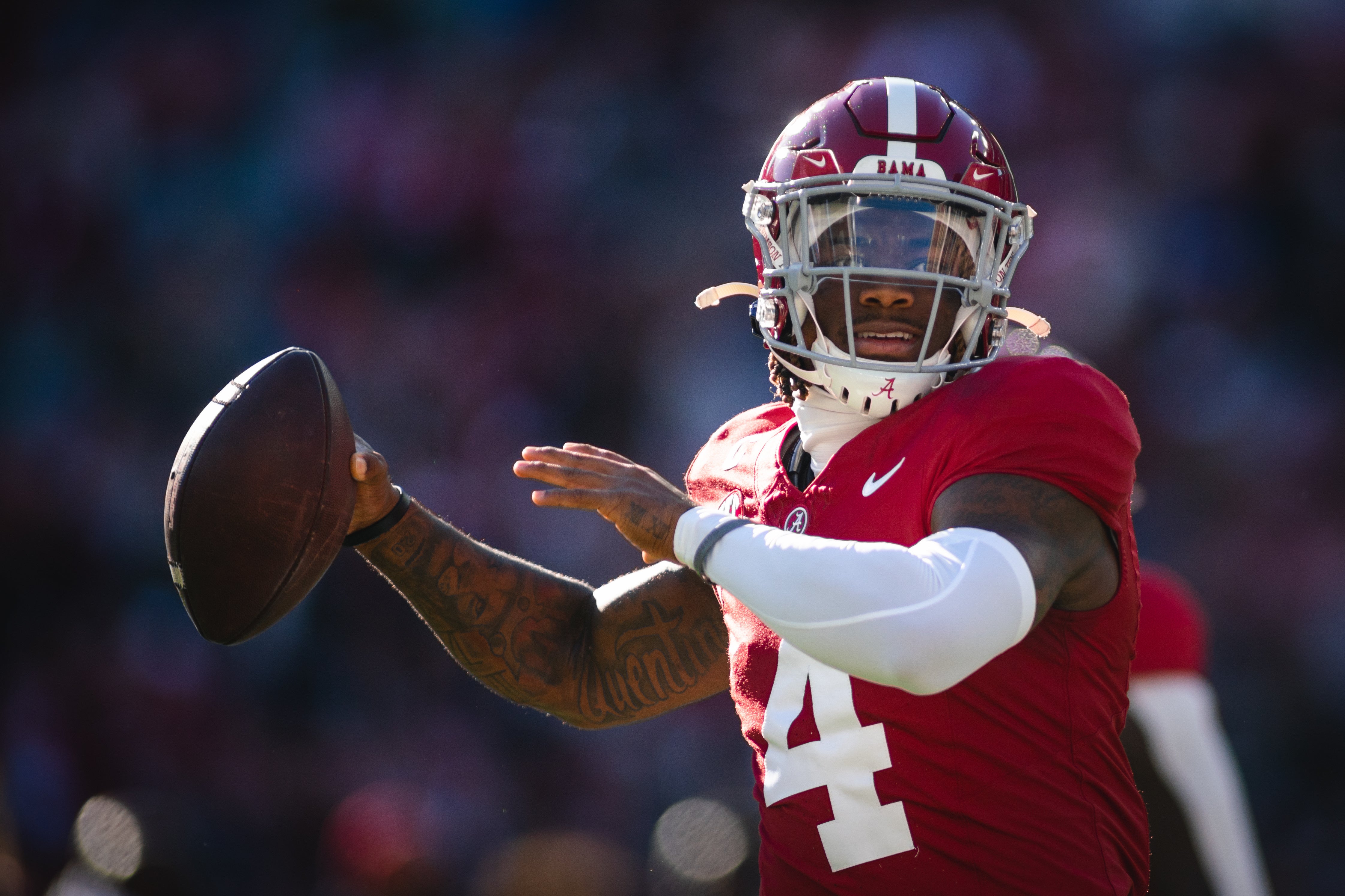 Nov 30, 2024; Tuscaloosa, Alabama, USA; Alabama Crimson Tide quarterback Jalen Milroe (4) warms up before a game against the Auburn Tigers at Bryant-Denny Stadium.