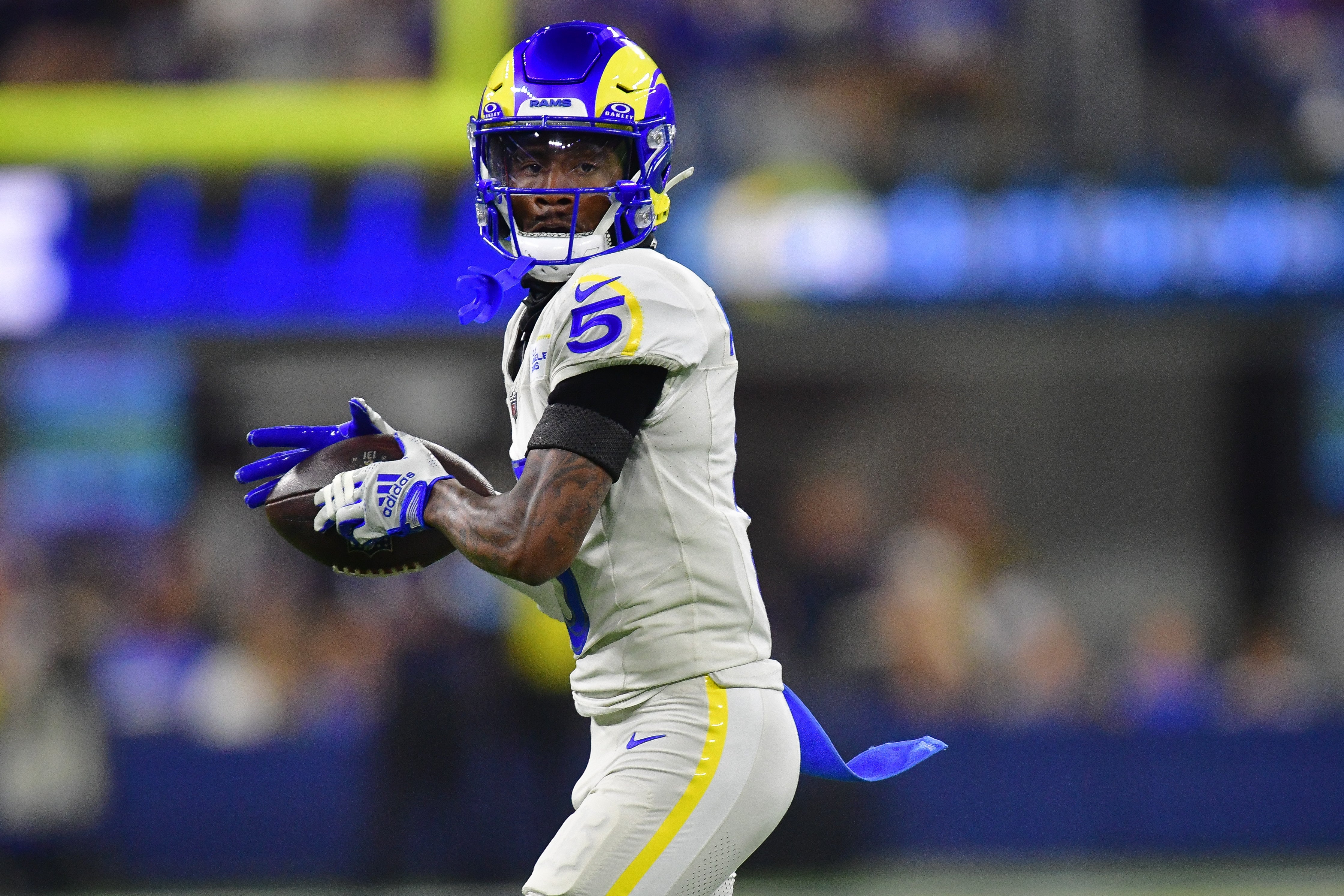 Los Angeles Rams wide receiver Tutu Atwell (5) runs the ball after catching a pass against the Minnesota Vikings during the second half at SoFi Stadium.