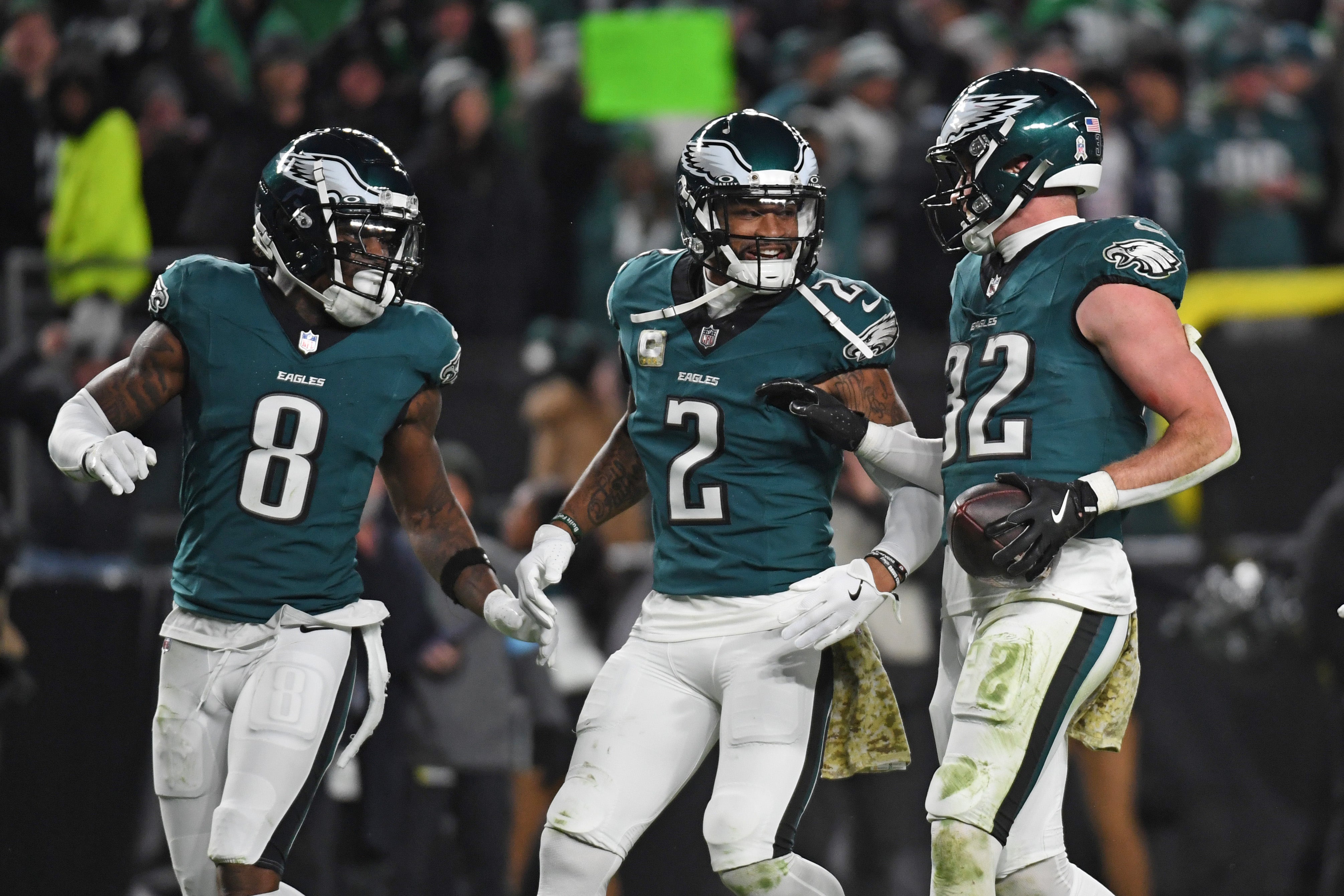 Philadelphia Eagles safety Reed Blankenship (32) celebrates his interception with safety C.J. Gardner-Johnson (8) and cornerback Darius Slay Jr. (2) against the Washington Commanders at Lincoln Financial Field.
