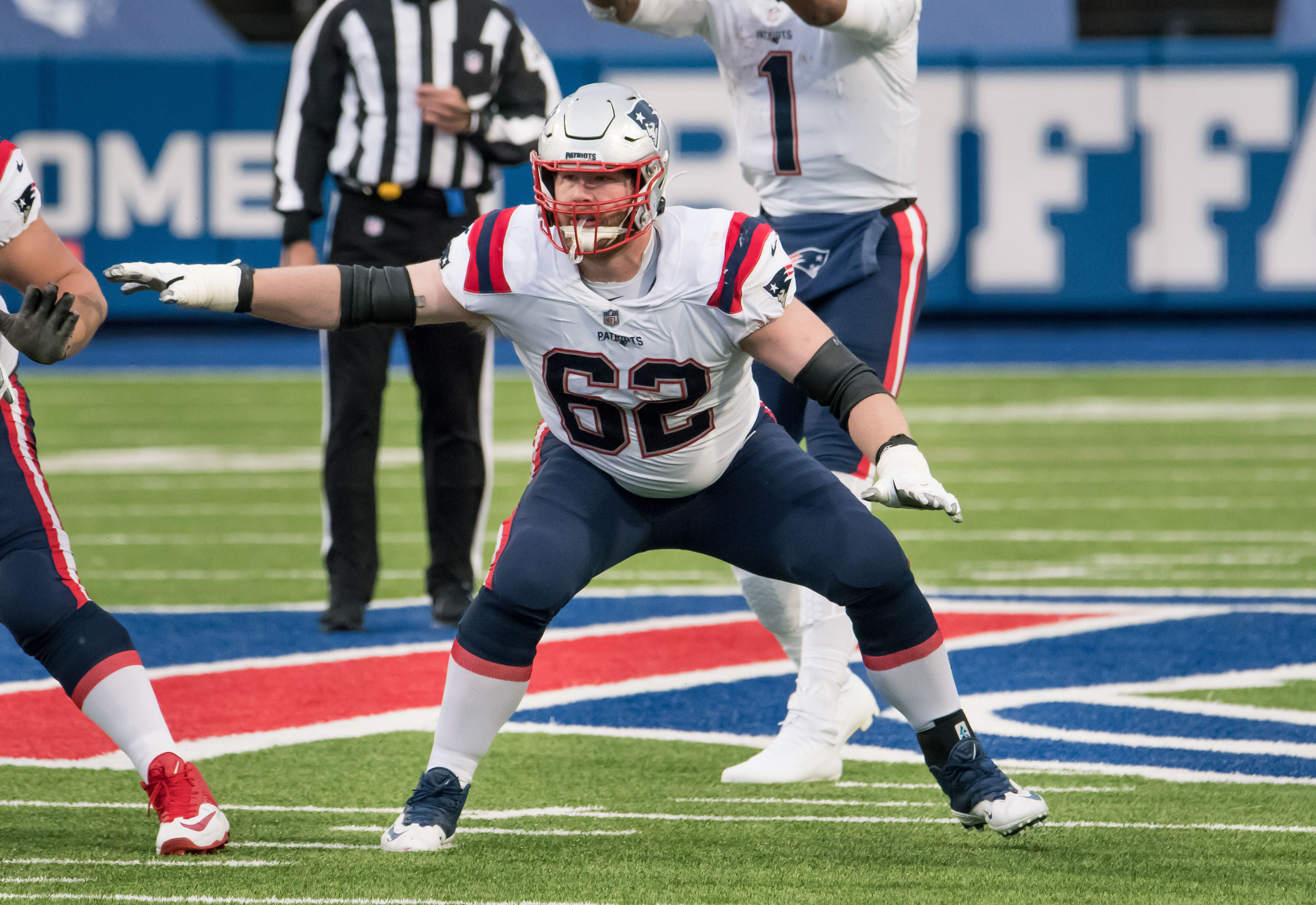 Nov 1, 2020; Orchard Park, New York, USA; New England Patriots offensive guard Joe Thuney (62) blocks on a play in the third quarter against the Buffalo Bills at Bills Stadium.