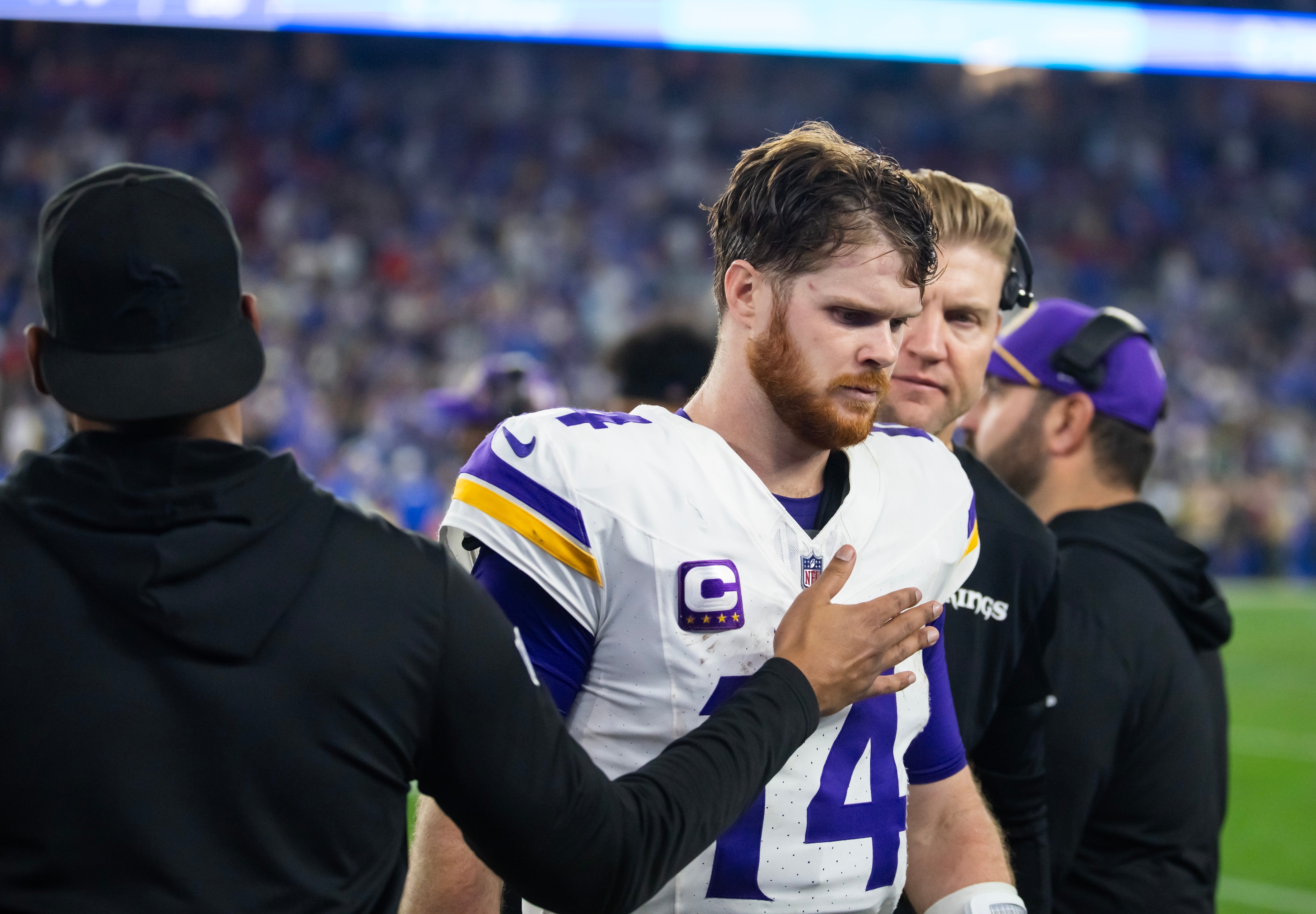 Jan 13, 2025; Glendale, AZ, USA; Minnesota Vikings quarterback Sam Darnold (14) reacts in the closing seconds of the game against the Los Angeles Rams during an NFC wild card game at State Farm Stadium.