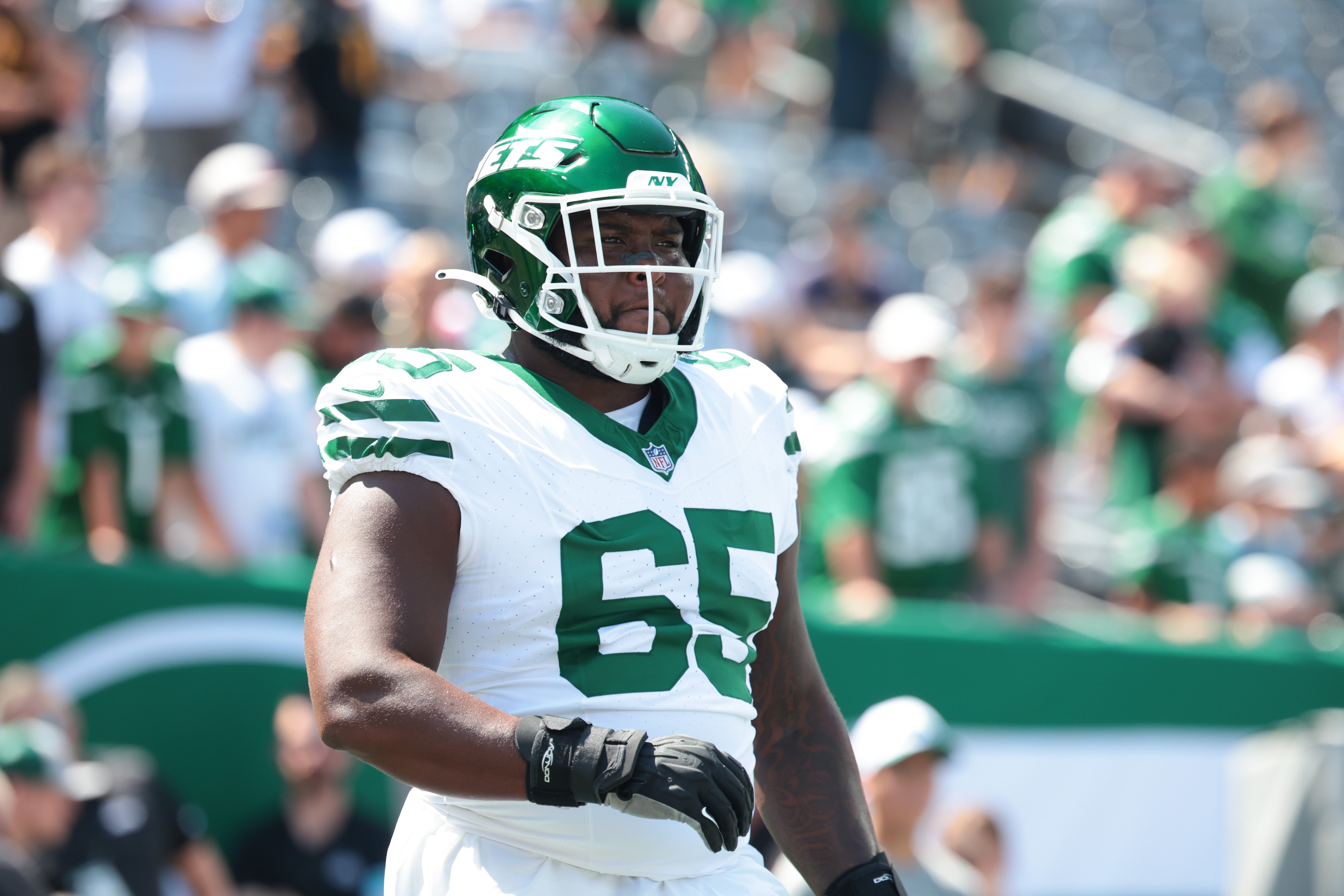 New York Jets guard Xavier Newman (65) looks on before the game against the Washington Commanders at MetLife Stadium.