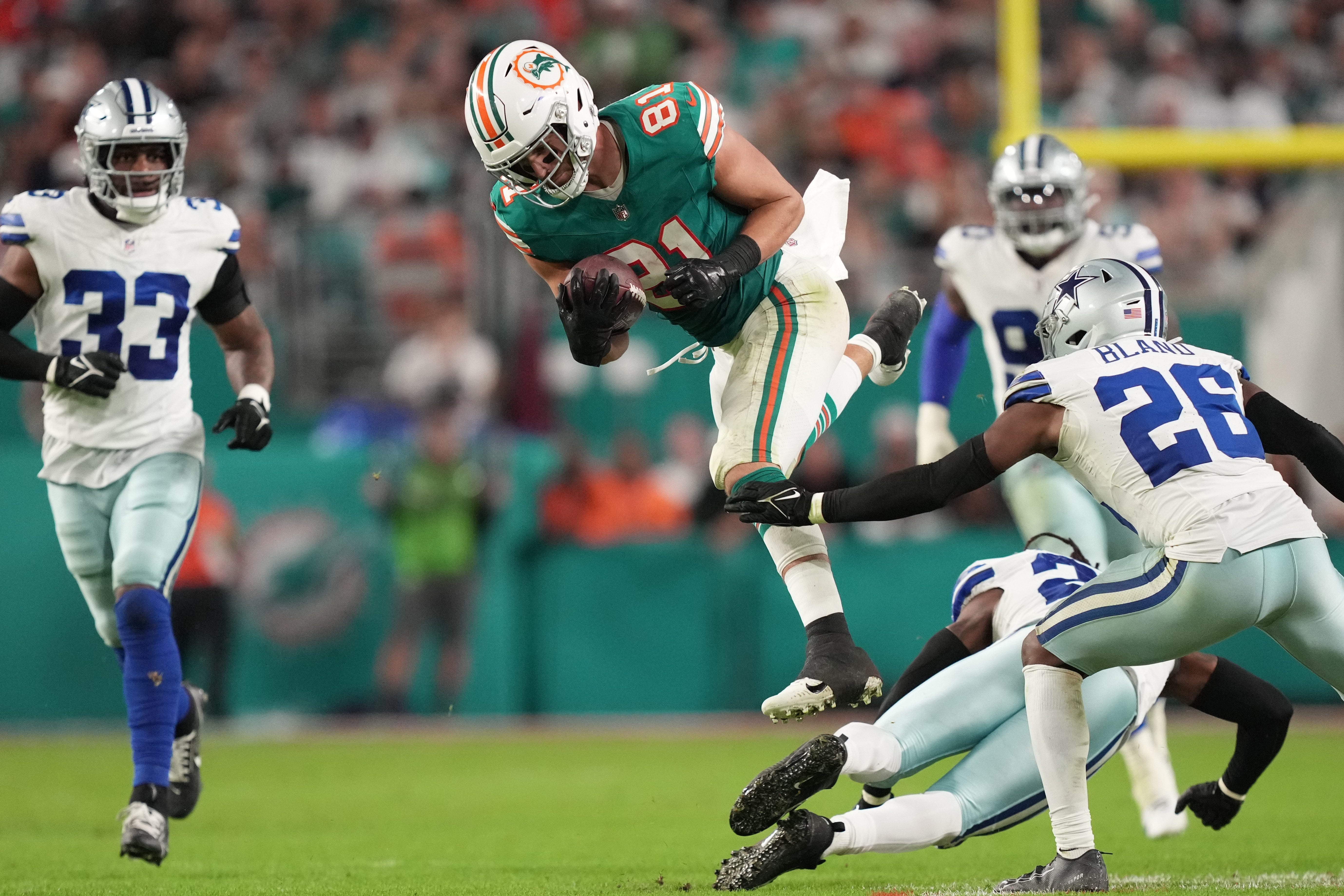 Miami Dolphins tight end Durham Smythe (81) gets a first down against the Dallas Cowboys during the second half of an NFL game at Hard Rock Stadium in Miami Gardens, Dec. 24, 2023.