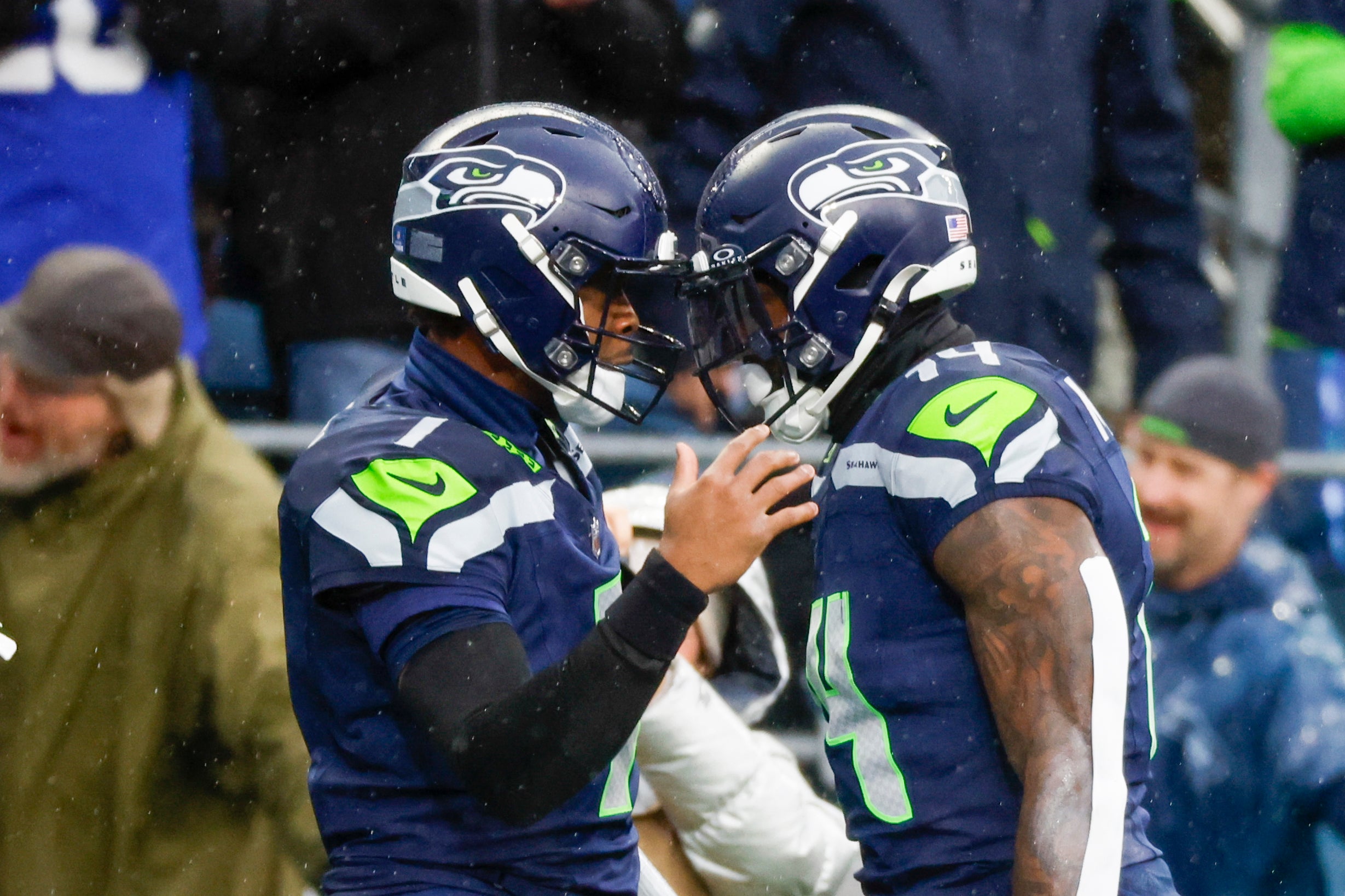Seattle Seahawks quarterback Geno Smith (7) celebrates with Seattle Seahawks wide receiver DK Metcalf (14) following a touchdown pass to Metcalf during the second quarter against the Minnesota Vikings at Lumen Field. 