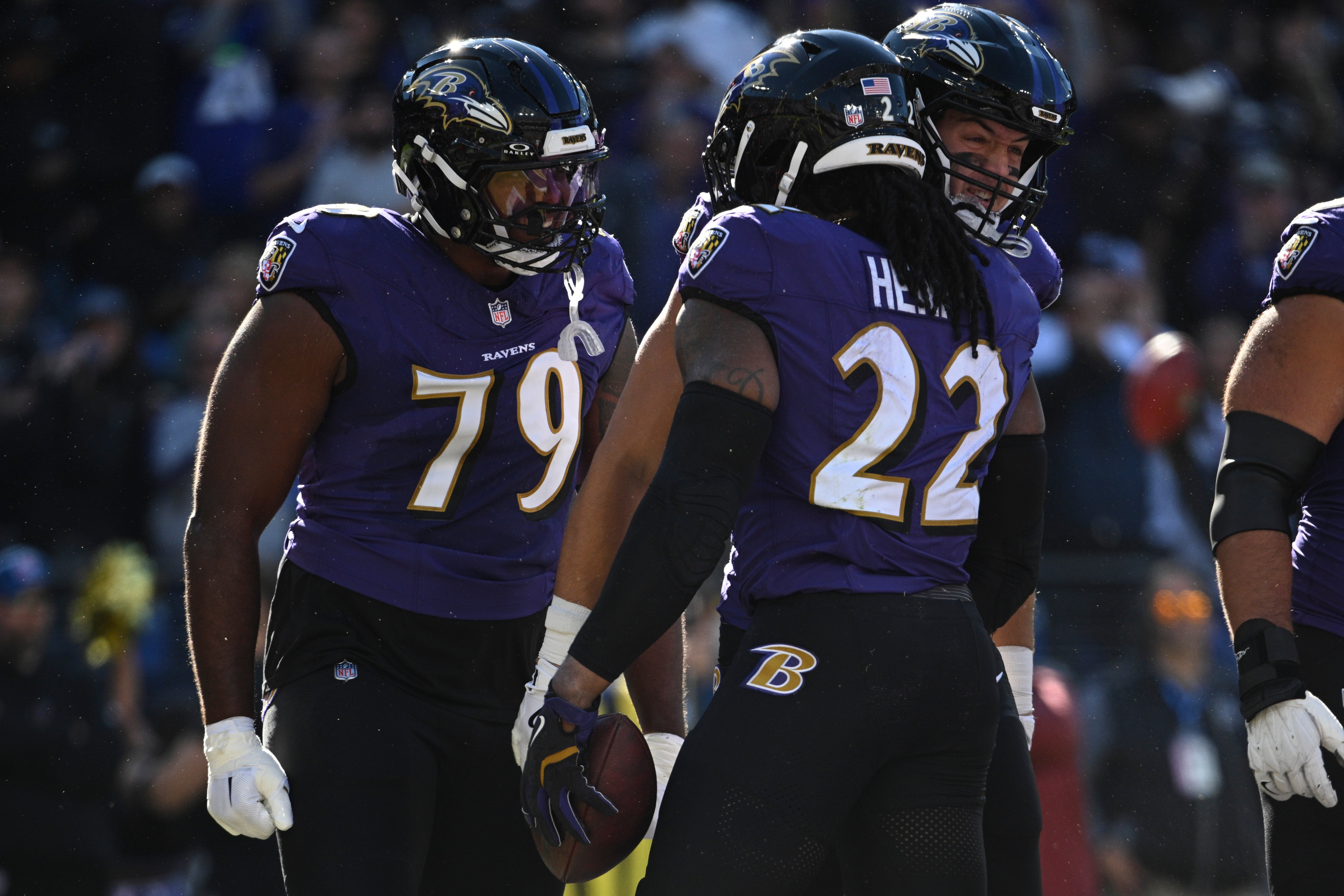 Ravens running back Derrick Henry (22) celebrates with offensive tackle Ronnie Stanley (79) after scoring a touchdown