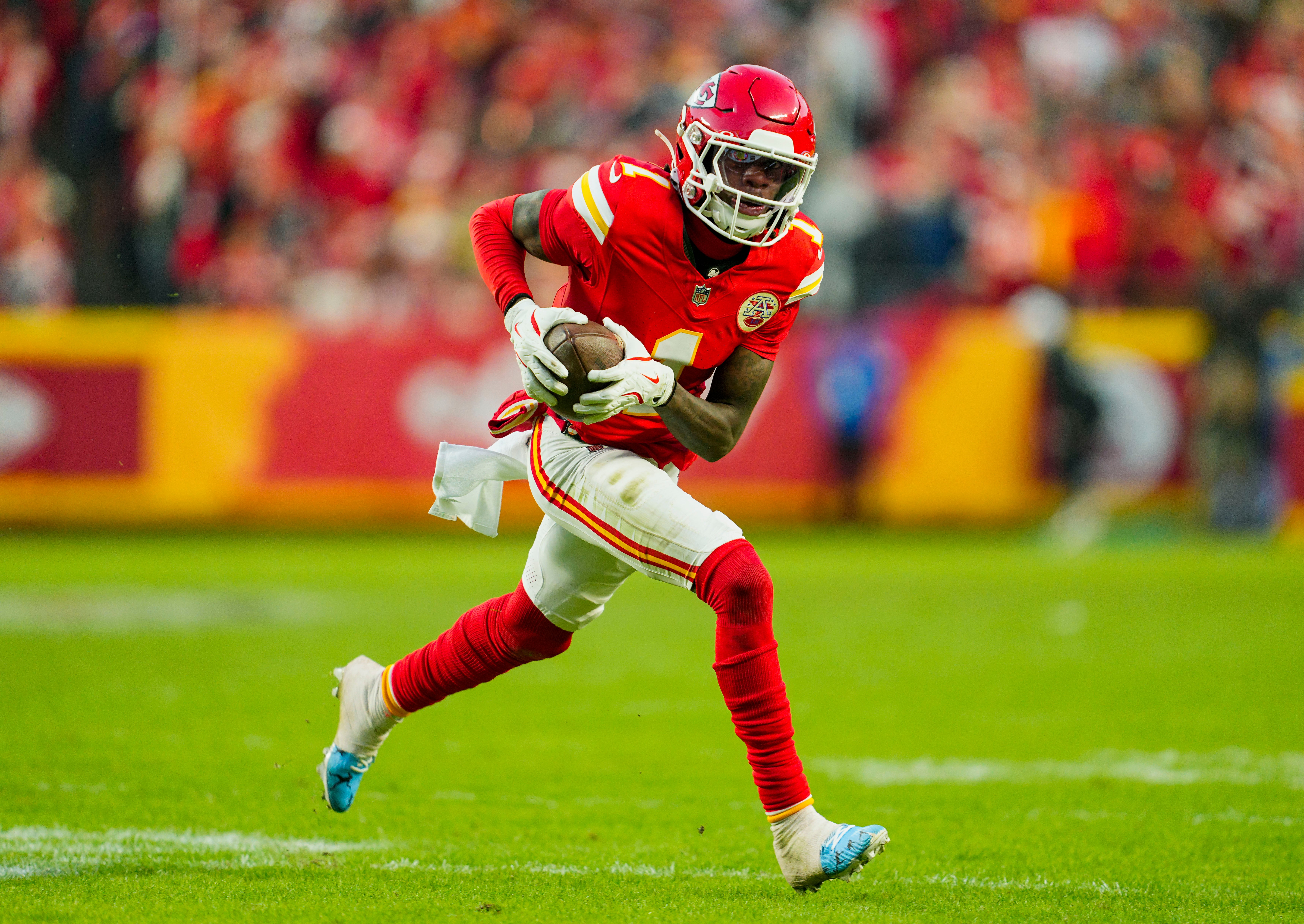 Nov 29, 2024; Kansas City, Missouri, USA; Kansas City Chiefs wide receiver Xavier Worthy (1) runs with the ball during the second half against the Las Vegas Raiders at GEHA Field at Arrowhead Stadium.
