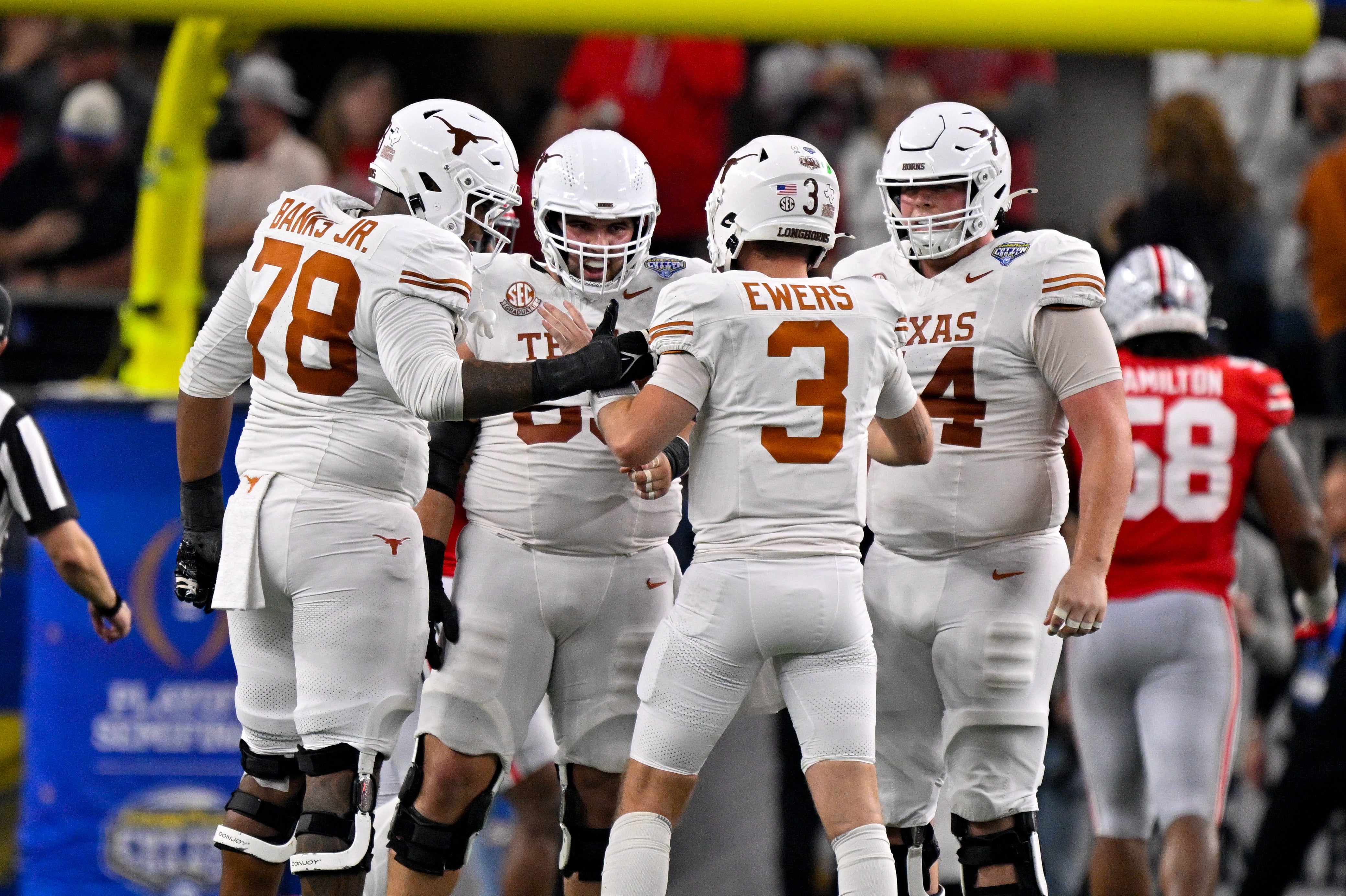 Kelvin Banks, Quinn Ewers, and other Texas OL huddle up against Ohio State