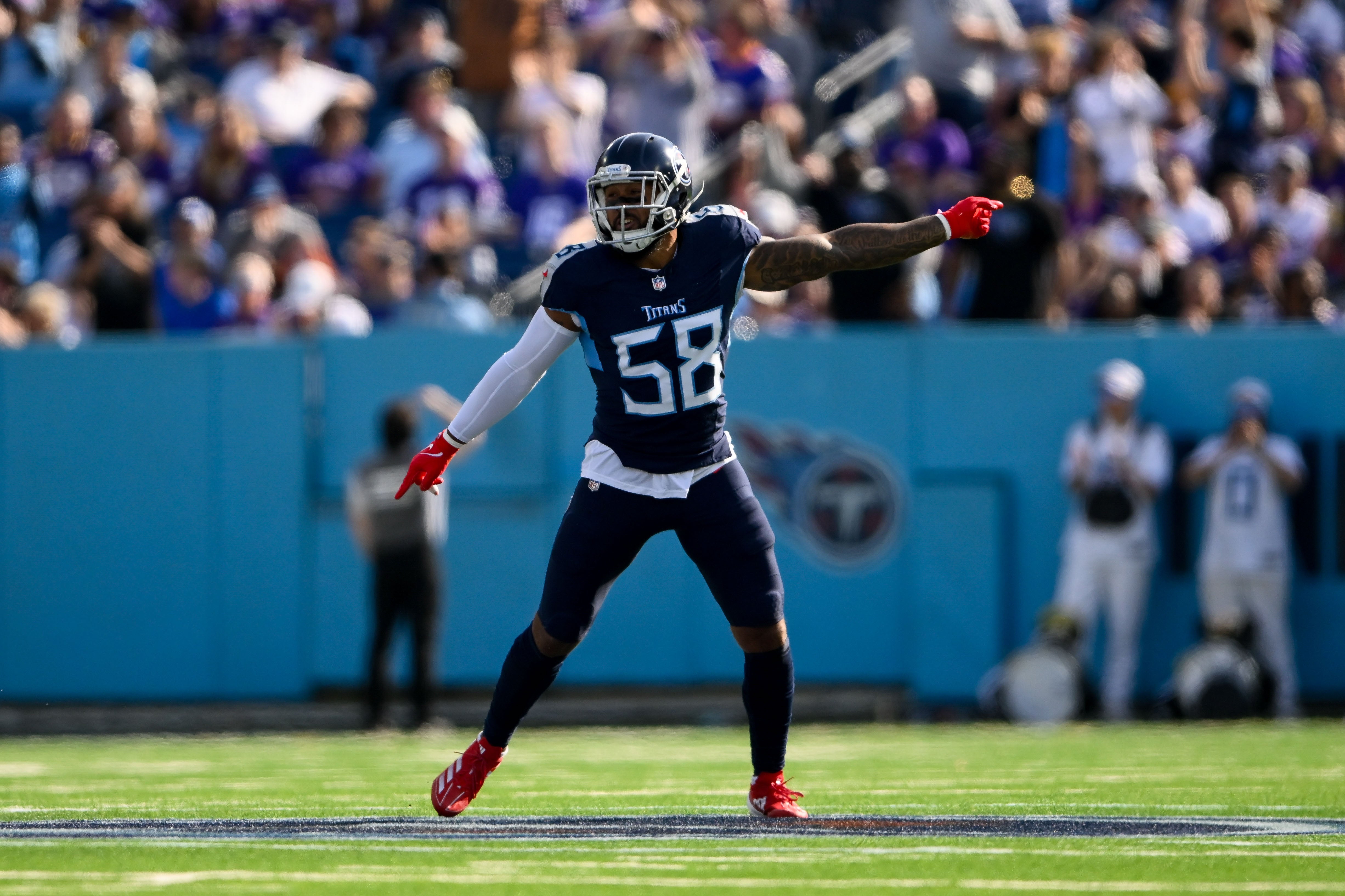 Nov 17, 2024; Nashville, Tennessee, USA; Tennessee Titans linebacker Harold Landry III (58) celebrates the fumble recovery against the Minnesota Vikings during the first half at Nissan Stadium.