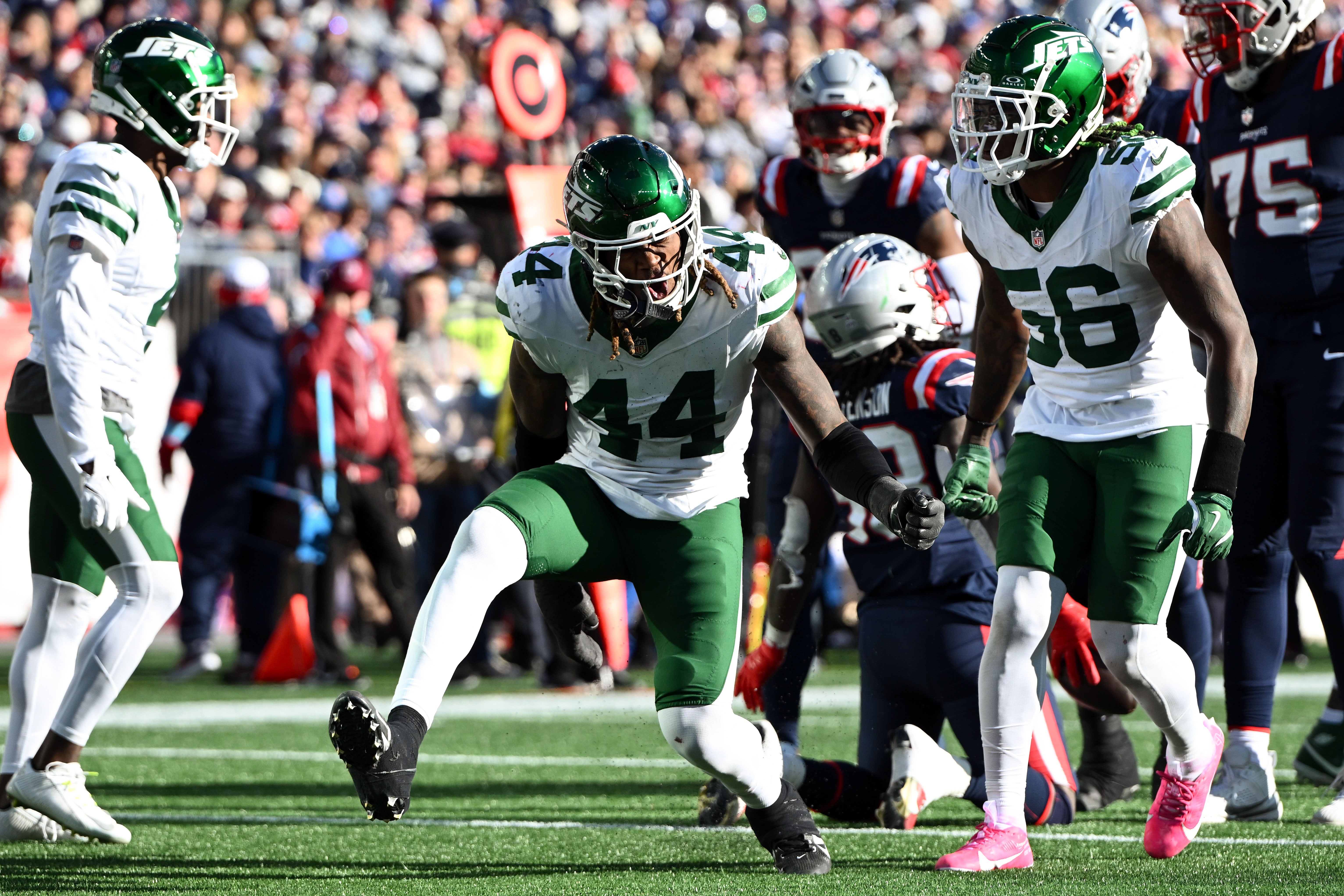 New York Jets linebacker Jamien Sherwood (44) reacts after breaking up a pass against the New England Patriots during the second half at Gillette Stadium.
