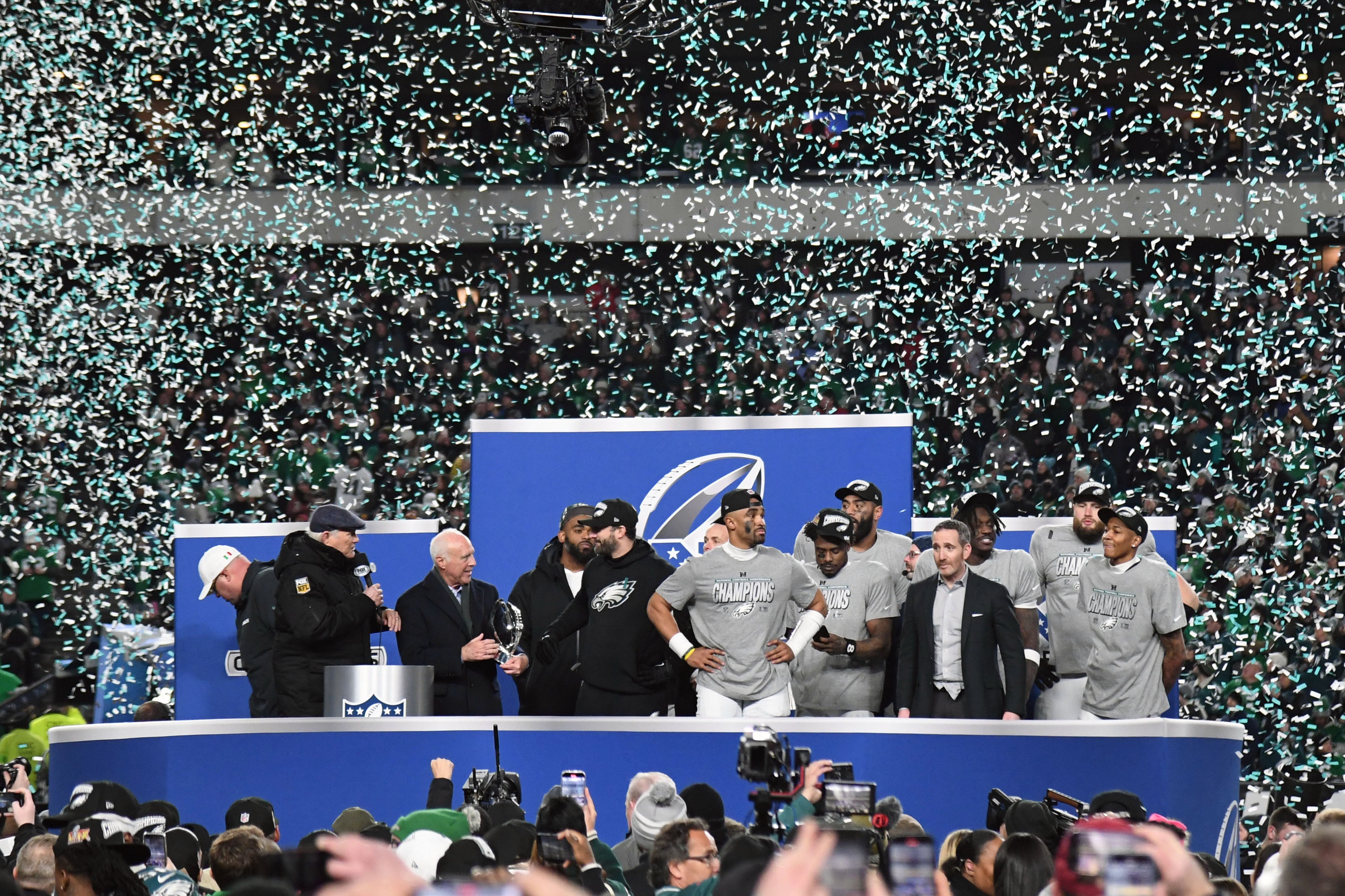 Philadelphia Eagles owner Jeffrey laurie, head coach Nick Siriani, quarterback Jalen Hurts (1) and general manager Howie Roseman during trophy presentation after defeating the Washington Commanders.