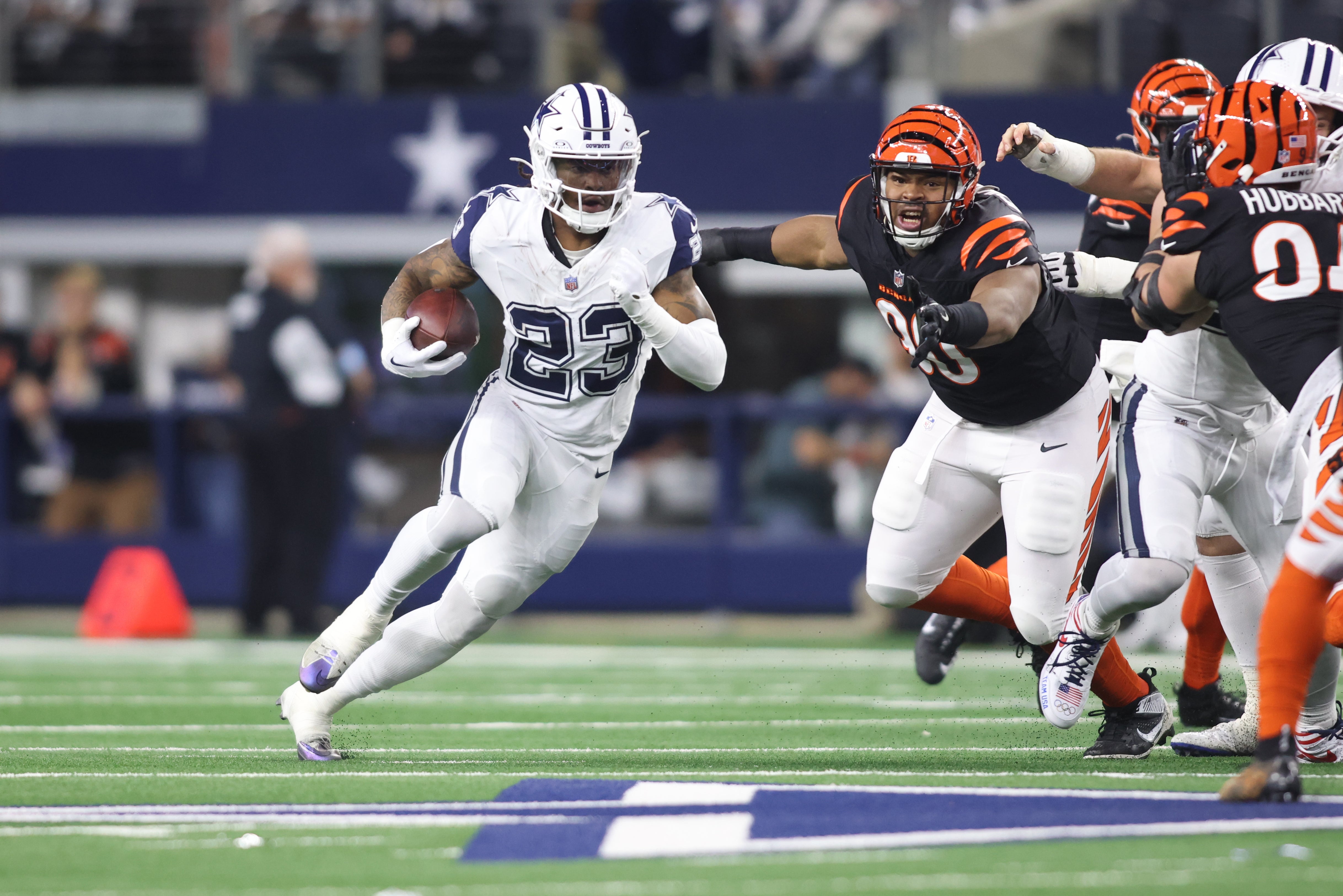 Dallas Cowboys running back Rico Dowdle (23) runs in the first quarter against the Cincinnati Bengals at AT&T Stadium.