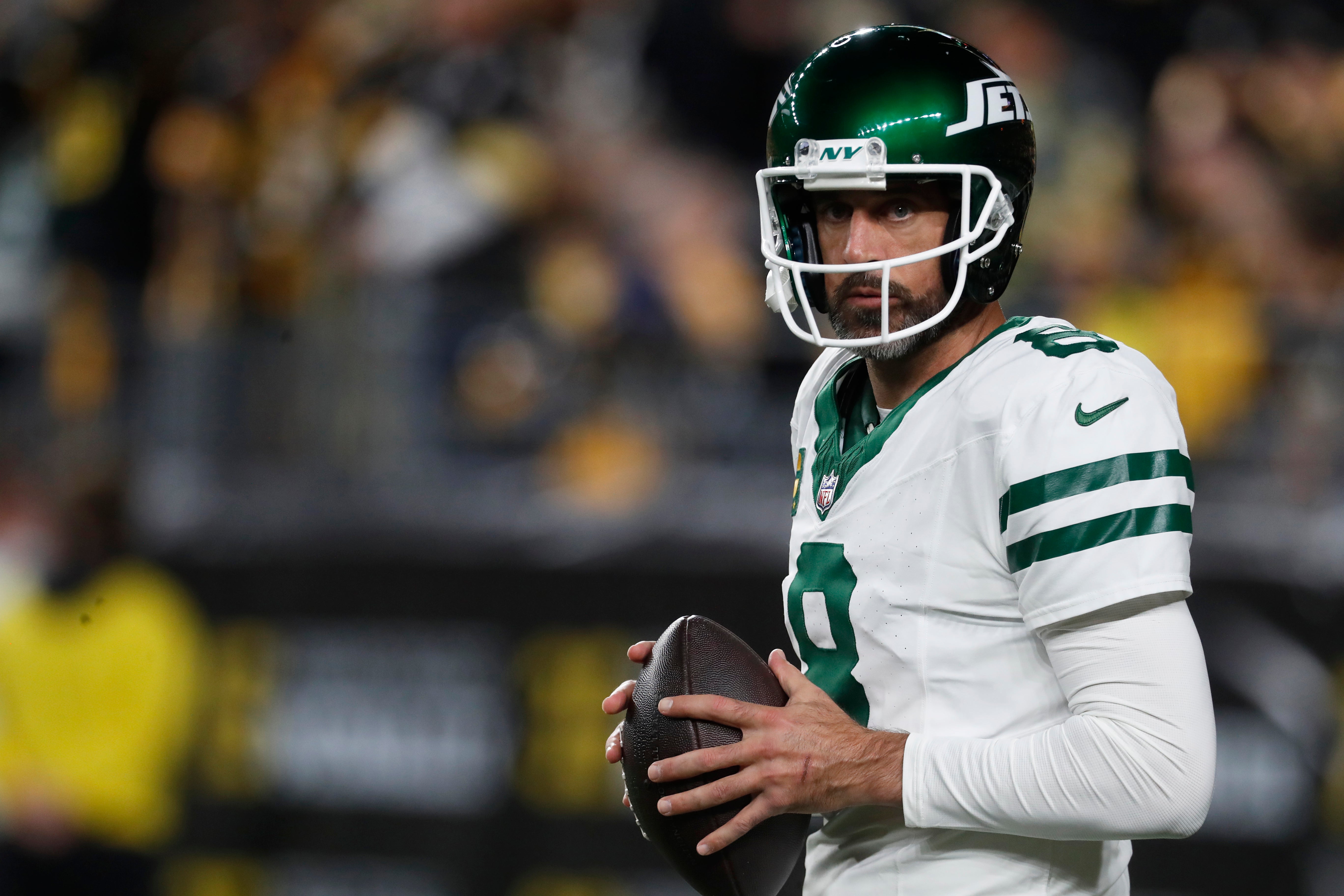 New York Jets quarterback Aaron Rodgers (8) warms up before the game against the Pittsburgh Steelers at Acrisure Stadium.