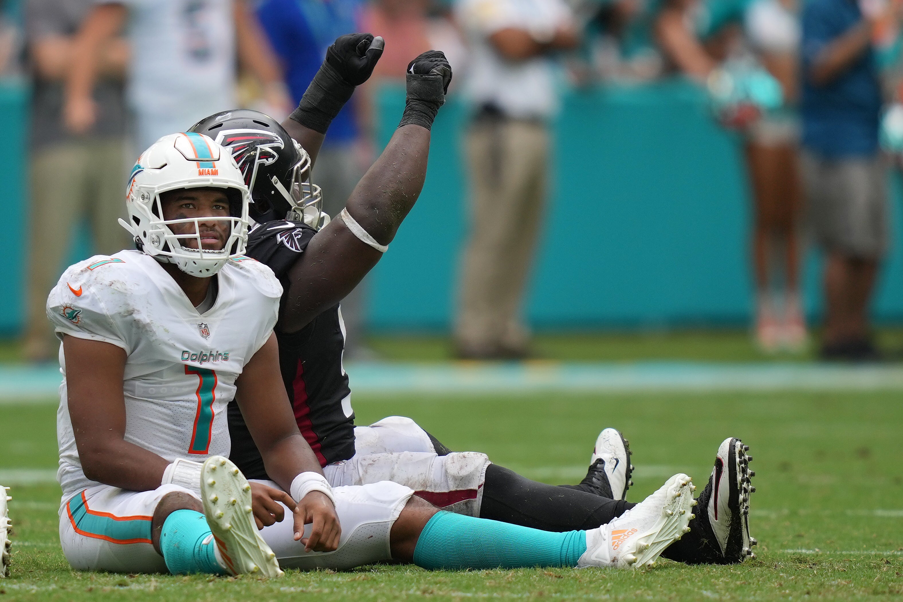 Oct 24, 2021; Miami Gardens, Florida, USA; Atlanta Falcons defensive tackle Grady Jarrett (97) celebrates after Miami Dolphins quarterback Tua Tagovailoa (1) throws an interception during the second half at Hard Rock Stadium.