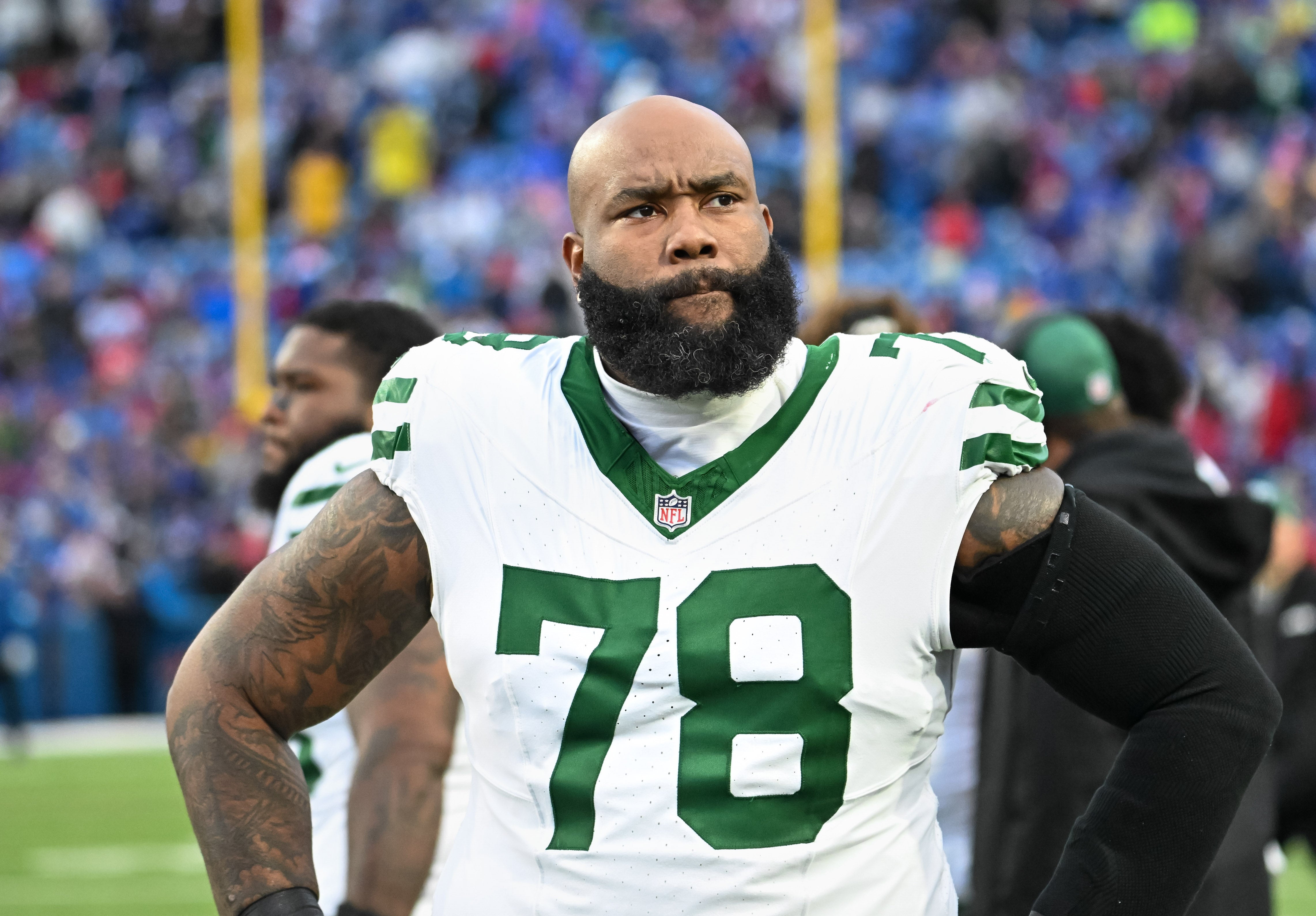 Dec 29, 2024; Orchard Park, New York, USA; New York Jets offensive tackle Morgan Moses (78) on the sideline before a game against the Buffalo Bills at Highmark Stadium.