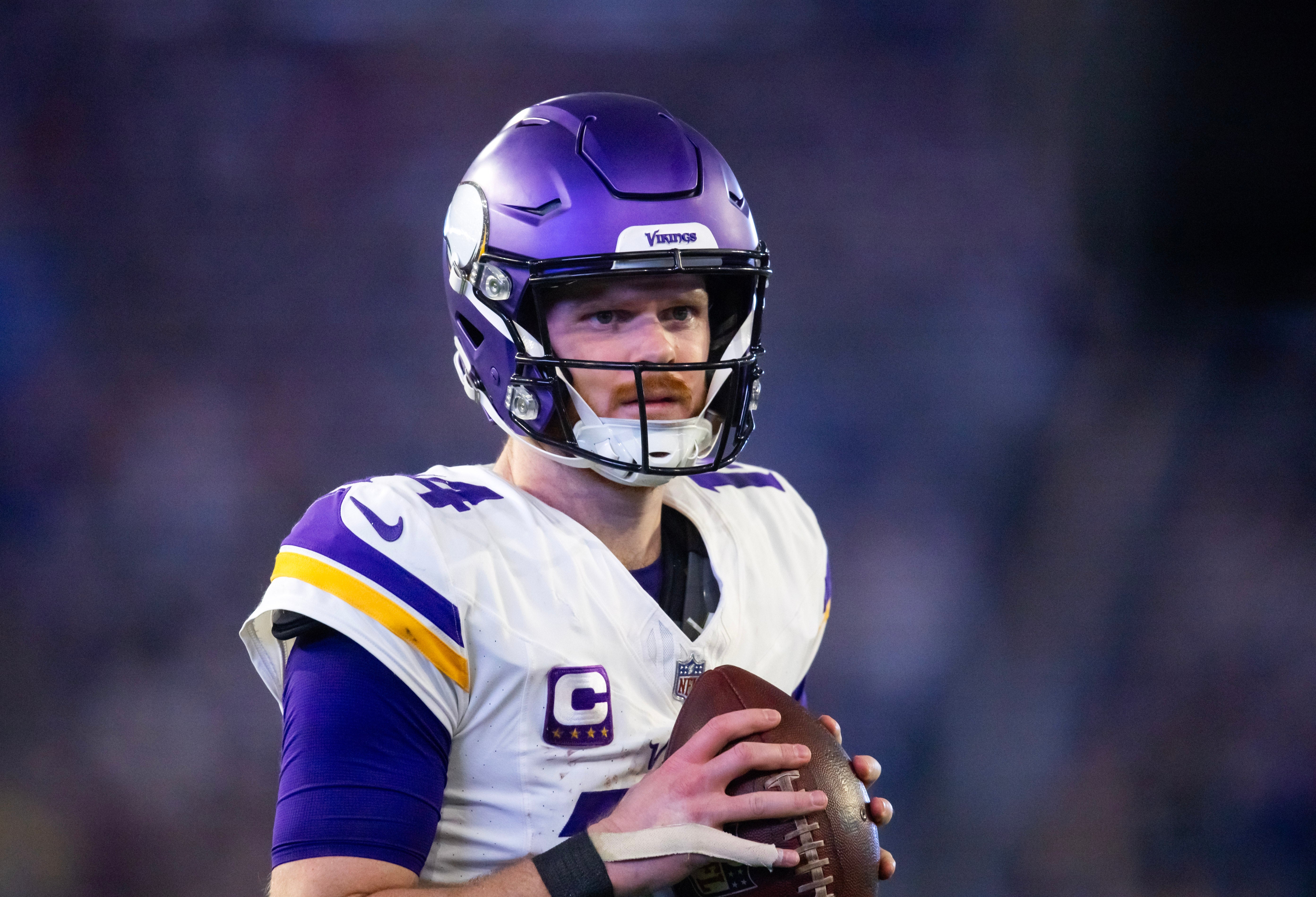 Jan 13, 2025; Glendale, AZ, USA; Minnesota Vikings quarterback Sam Darnold (14) against the Los Angeles Rams during an NFC wild card game at State Farm Stadium.