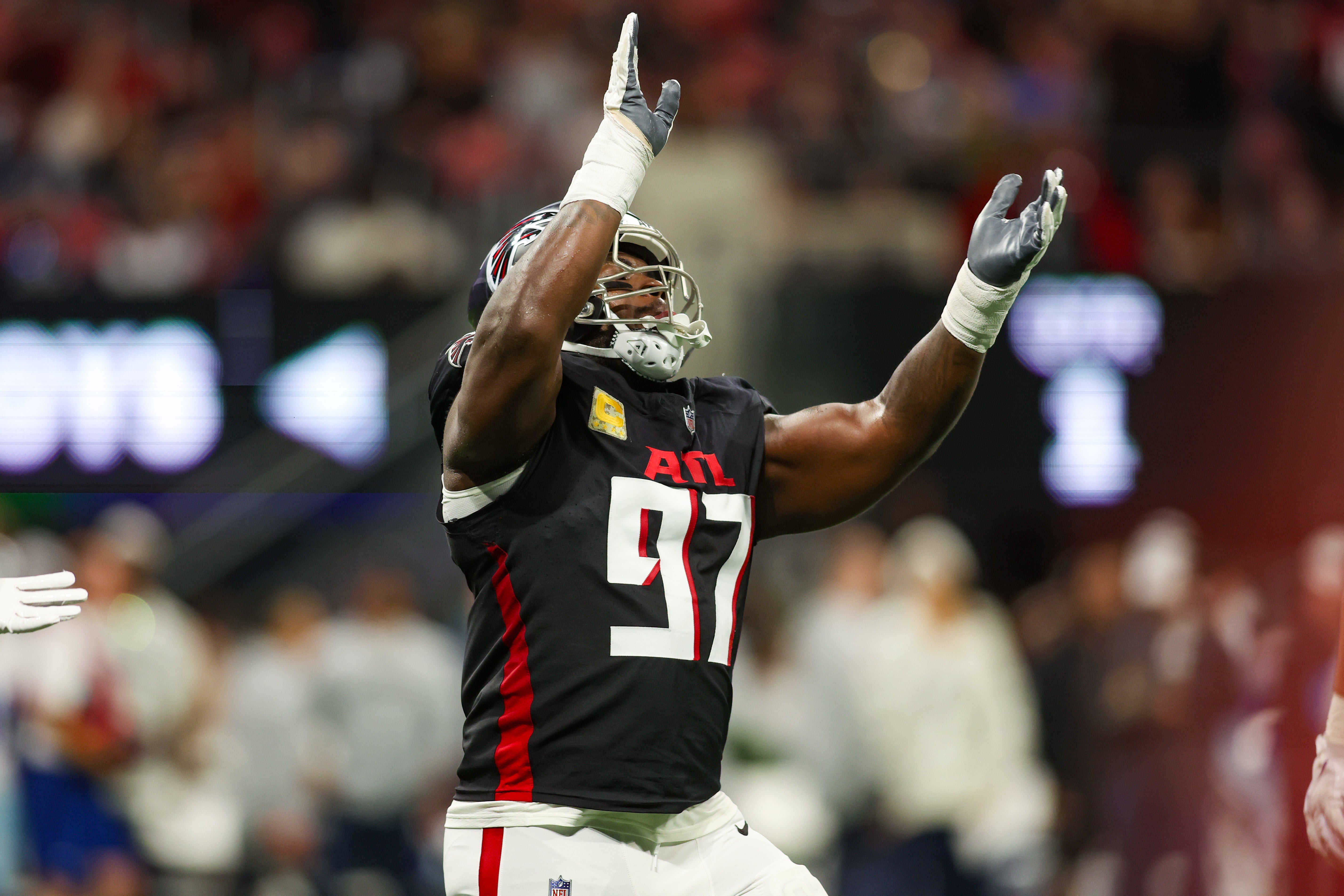 Nov 3, 2024; Atlanta, Georgia, USA; Atlanta Falcons defensive end Grady Jarrett (97) celebrates after a sack against the Dallas Cowboys in the first quarter at Mercedes-Benz Stadium.